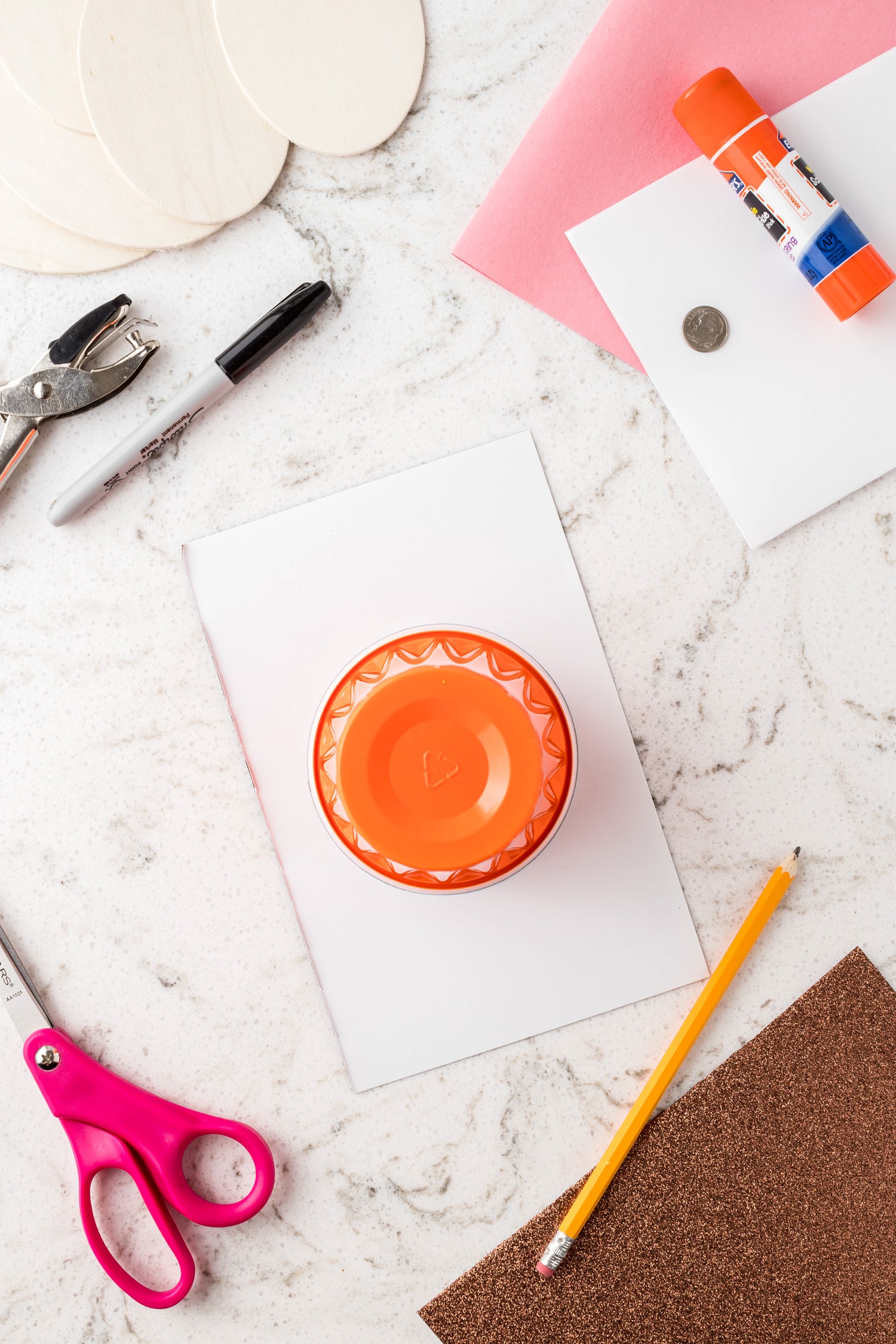 Tracing solo cup on white paper