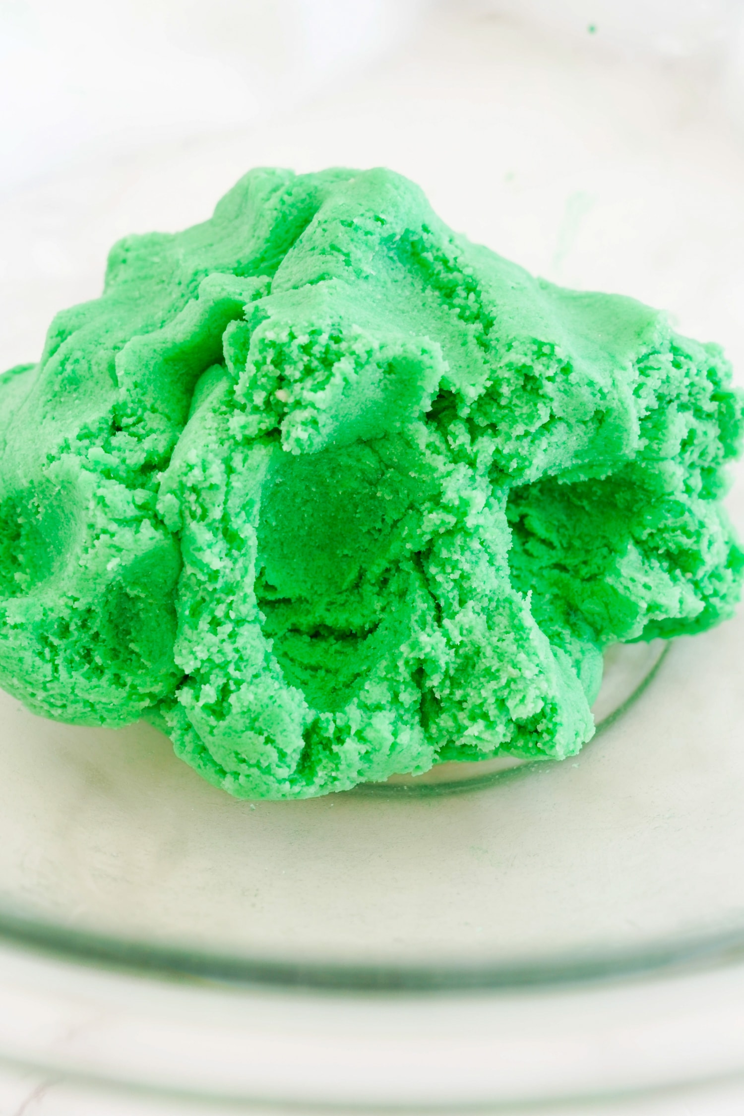 Green sugar cookie dough in glass ball