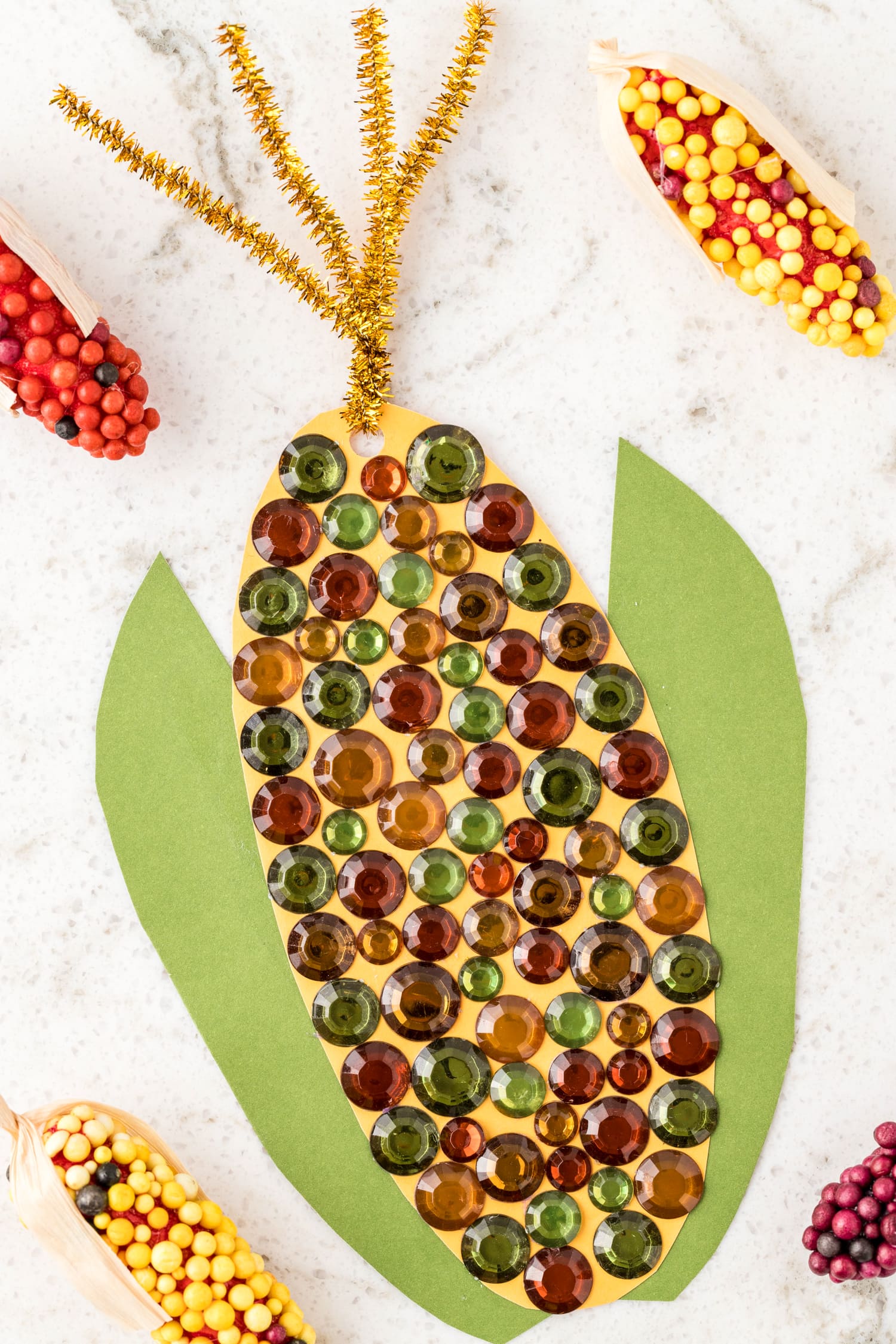 Indian Corn Craft laying on marble background