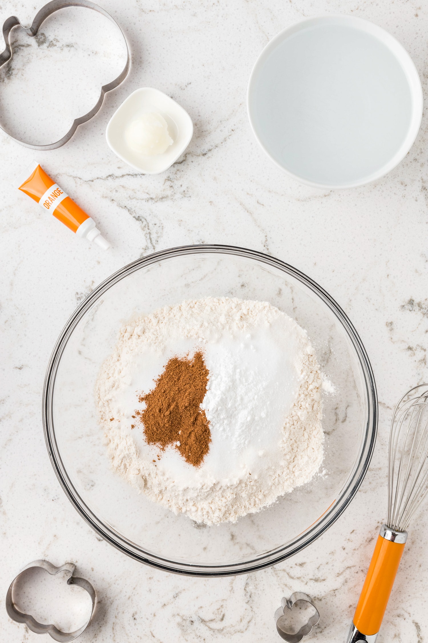 Dry ingredient for Pumpkin Playdough in glass bowl