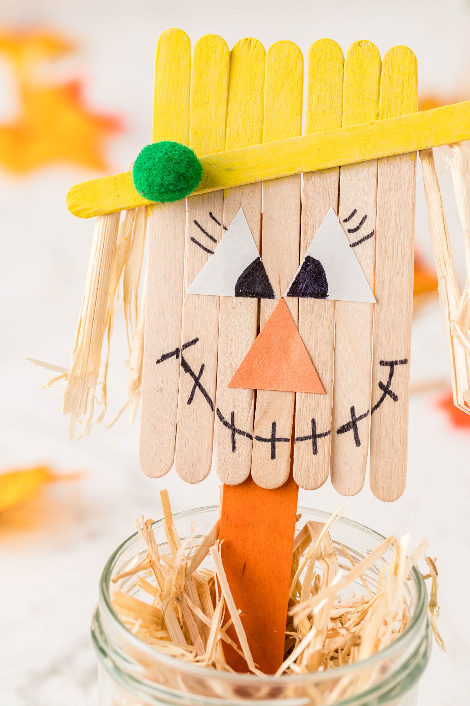 Scarecrow craft made out of popsicle sticks