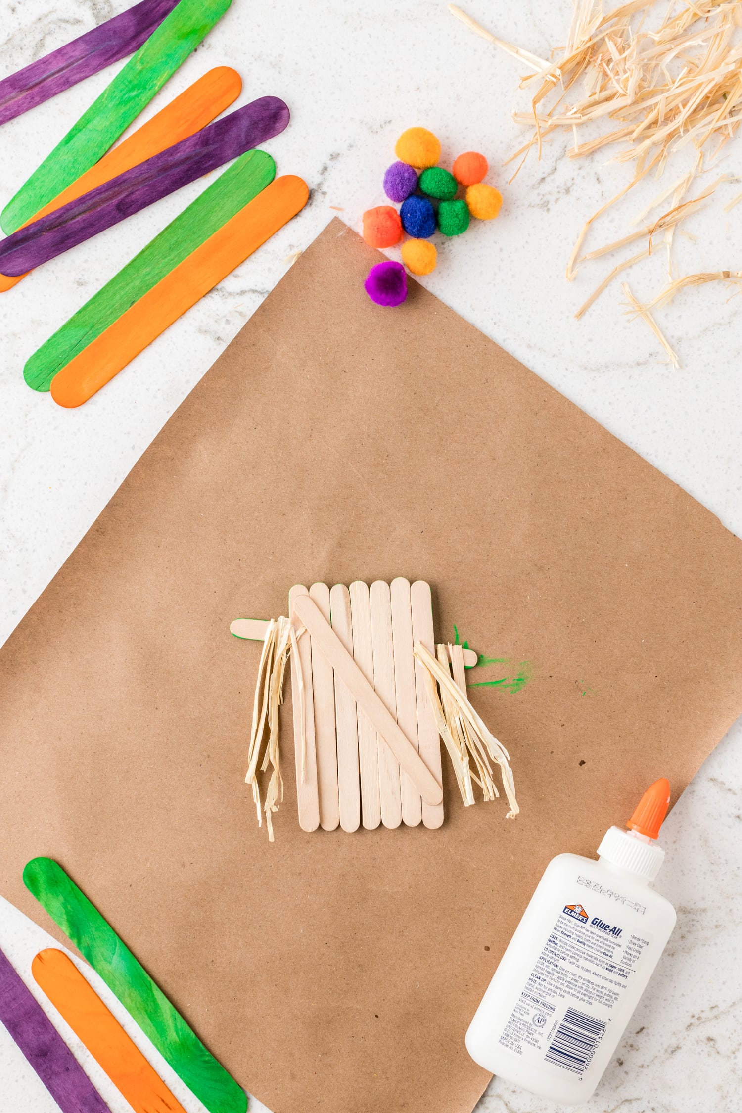 Natural raffia glued to scarecrow craft for hair