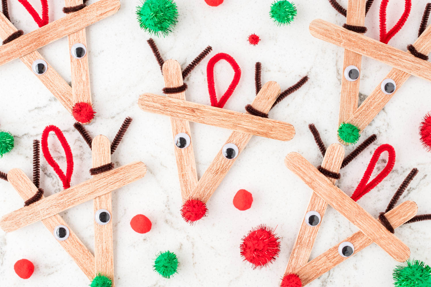 Reindeer Popsicle Stick Crafts on marble backgrounds