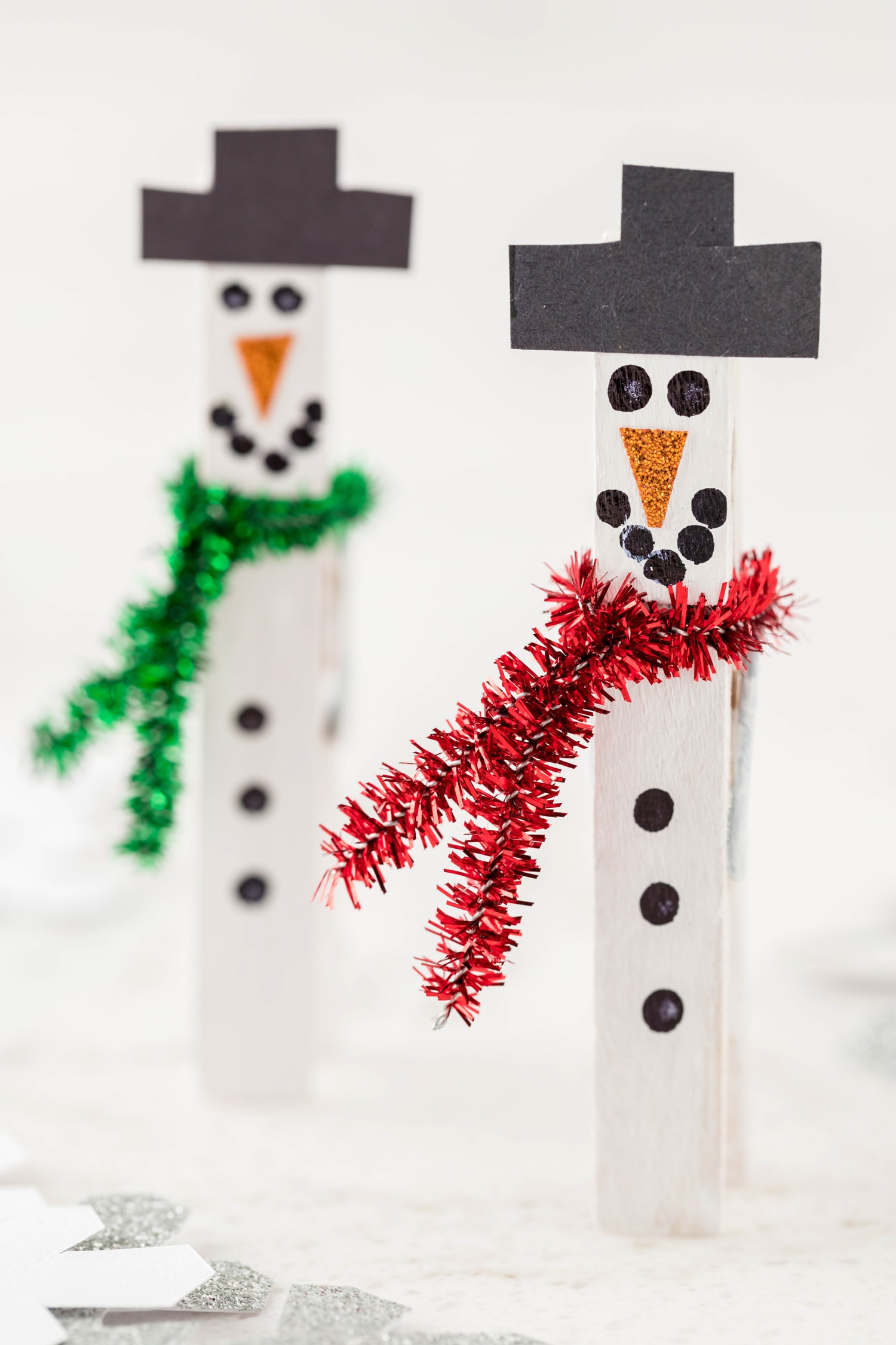 Snowman made out of clothespins standing up