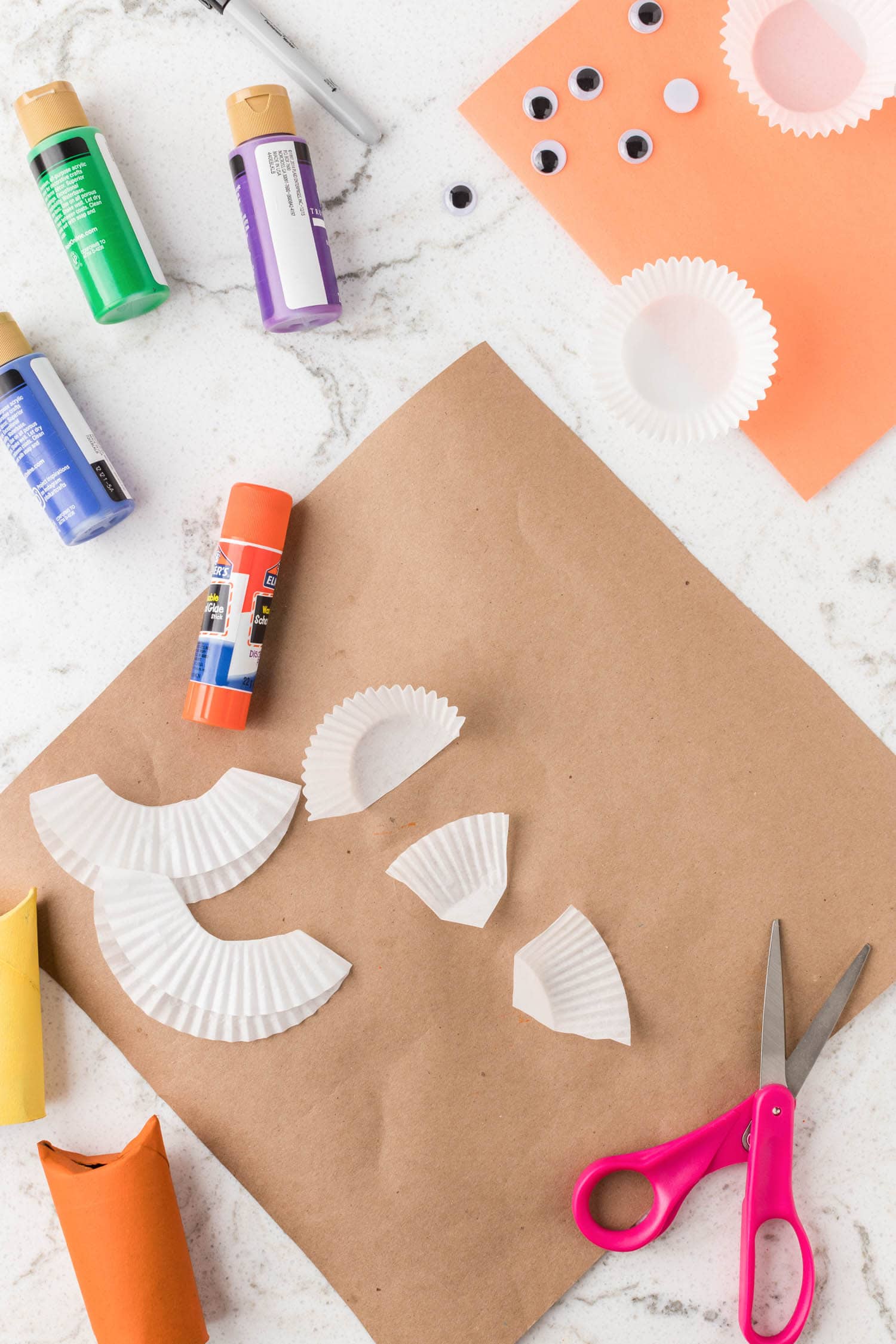 Fold cut Cupcake Liners in half and in half again to make the wings