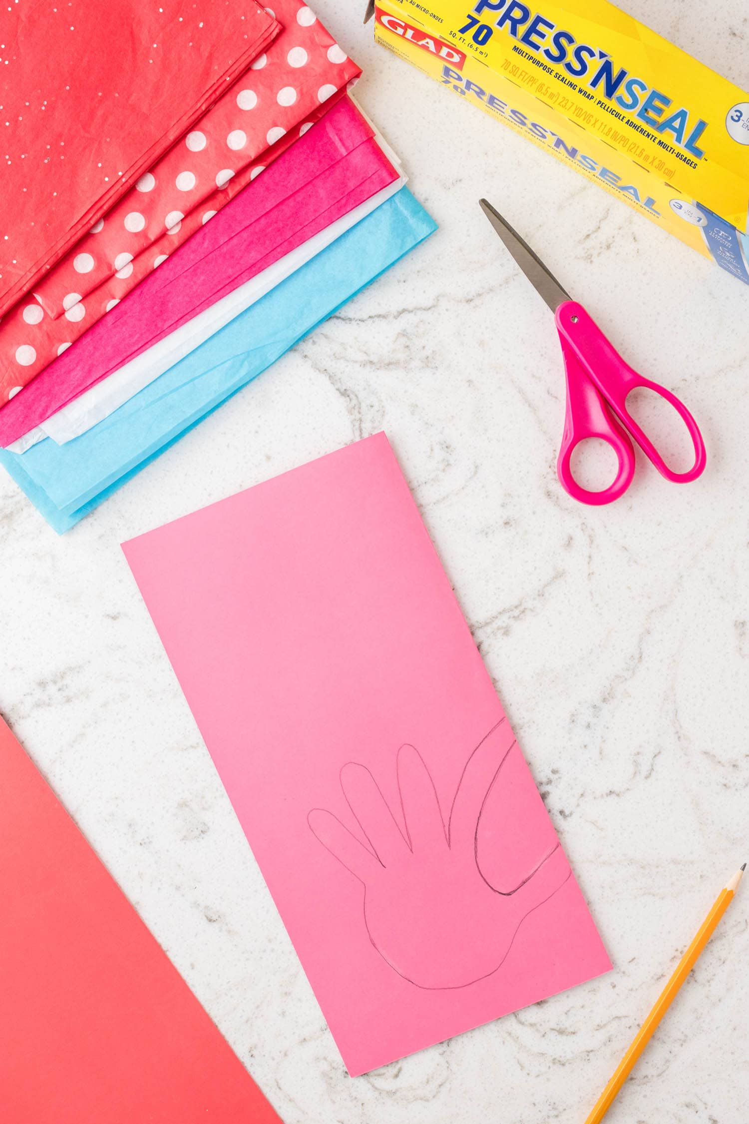 Fold Card Stock in Half Vertically and Trace Your Hand Like you Would be Making a Heart