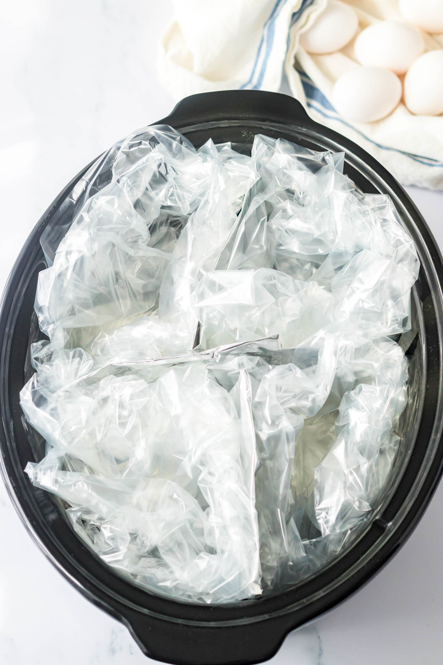 Place Slow Cooker Bags into Each Section of in the crock pot