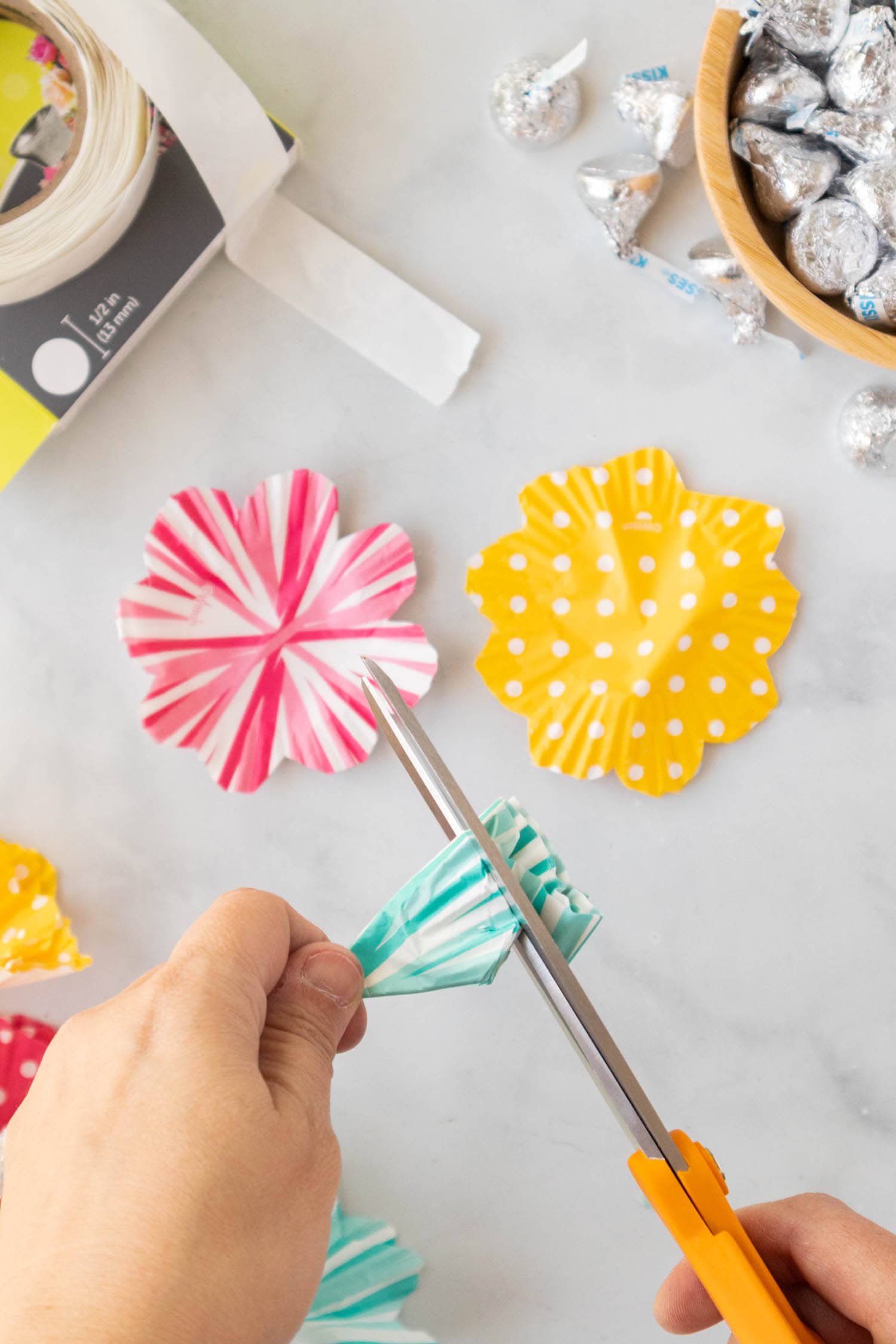 Take 5 of the Same Cupcake Liners and Fold into Quarters and Shape them into Petals.
