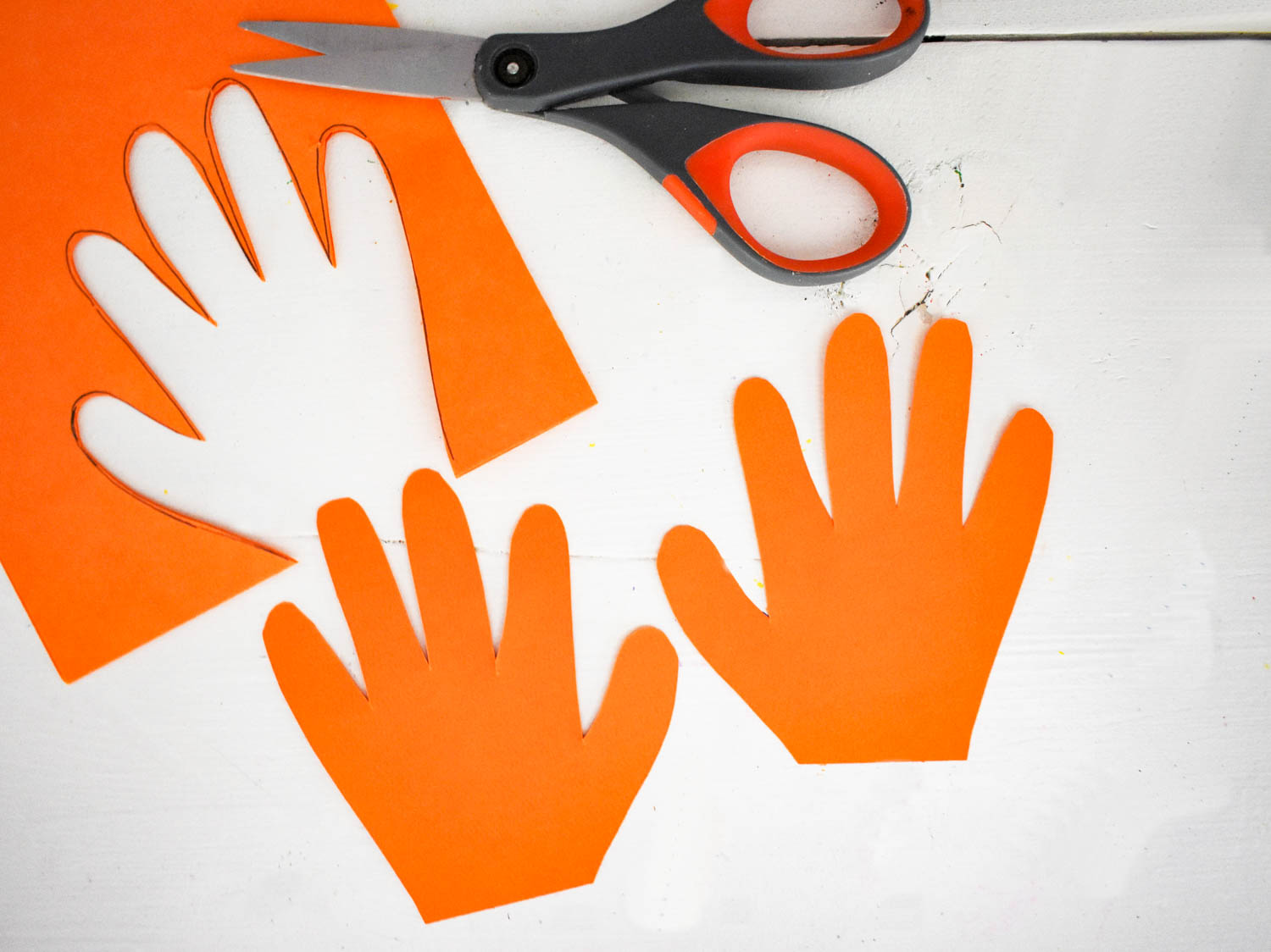 Trace both hands on Orange Cardstock and cut out
