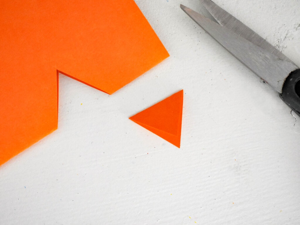 Cut out a Triangle Beak from the orange cardstock