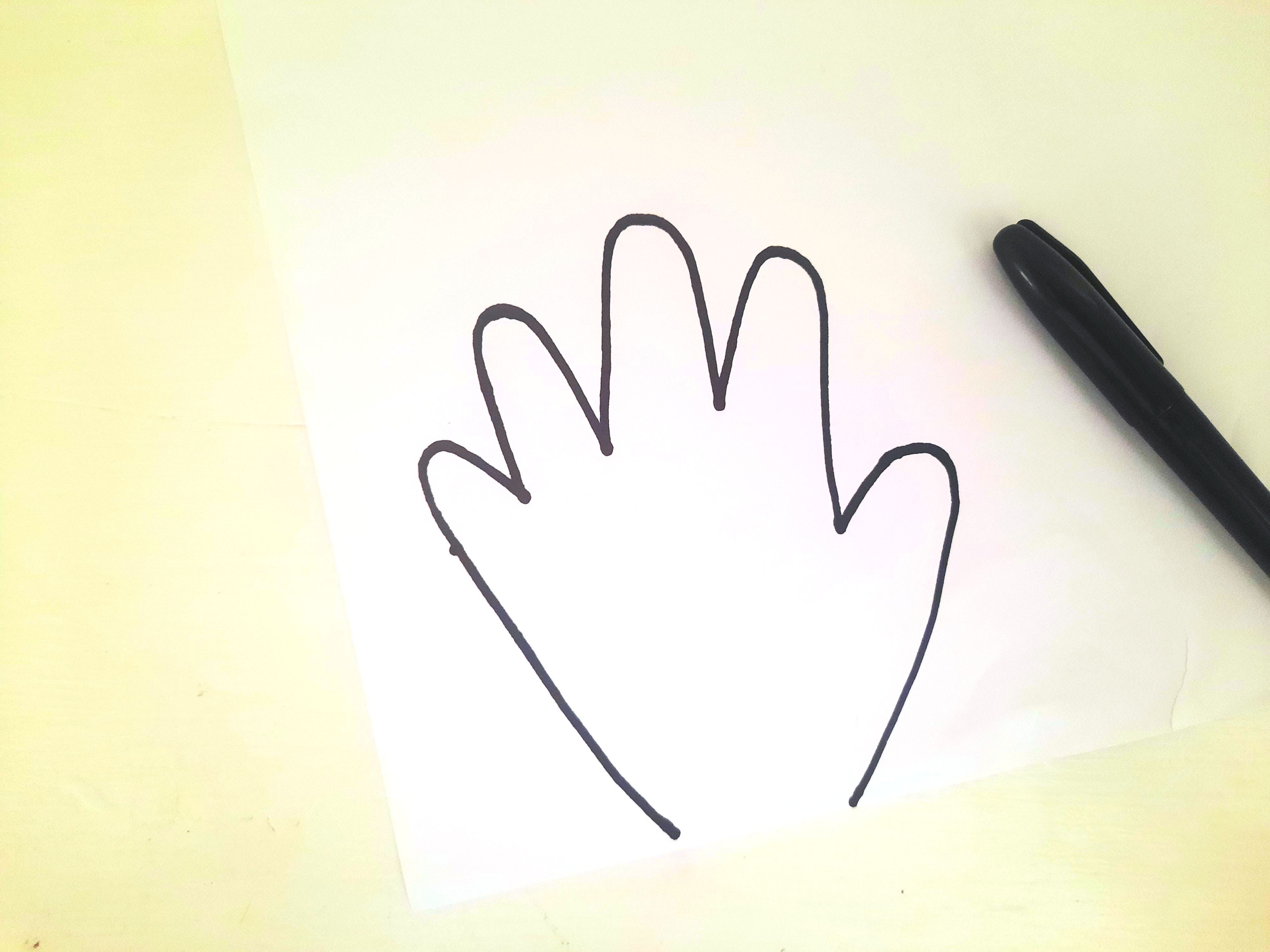 Trace your Kids Hand on the White Cardstock