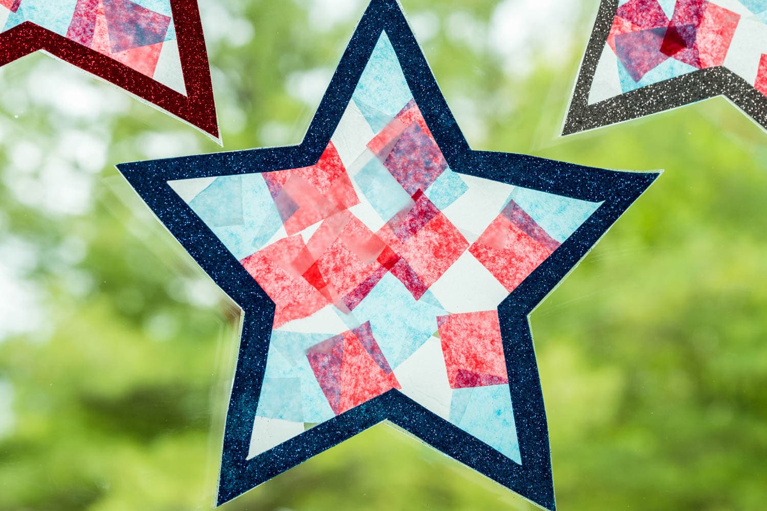 a Star Suncatcher taped to a window.