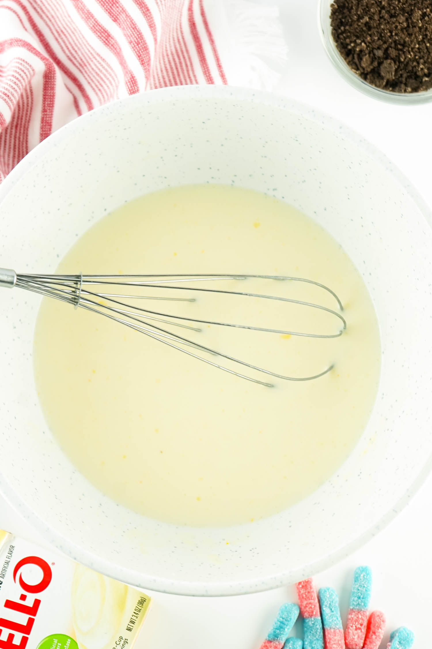 Whisk together the Milk and Pudding until thickened.