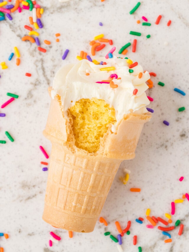 a bite taken out of a completed ice cream cone