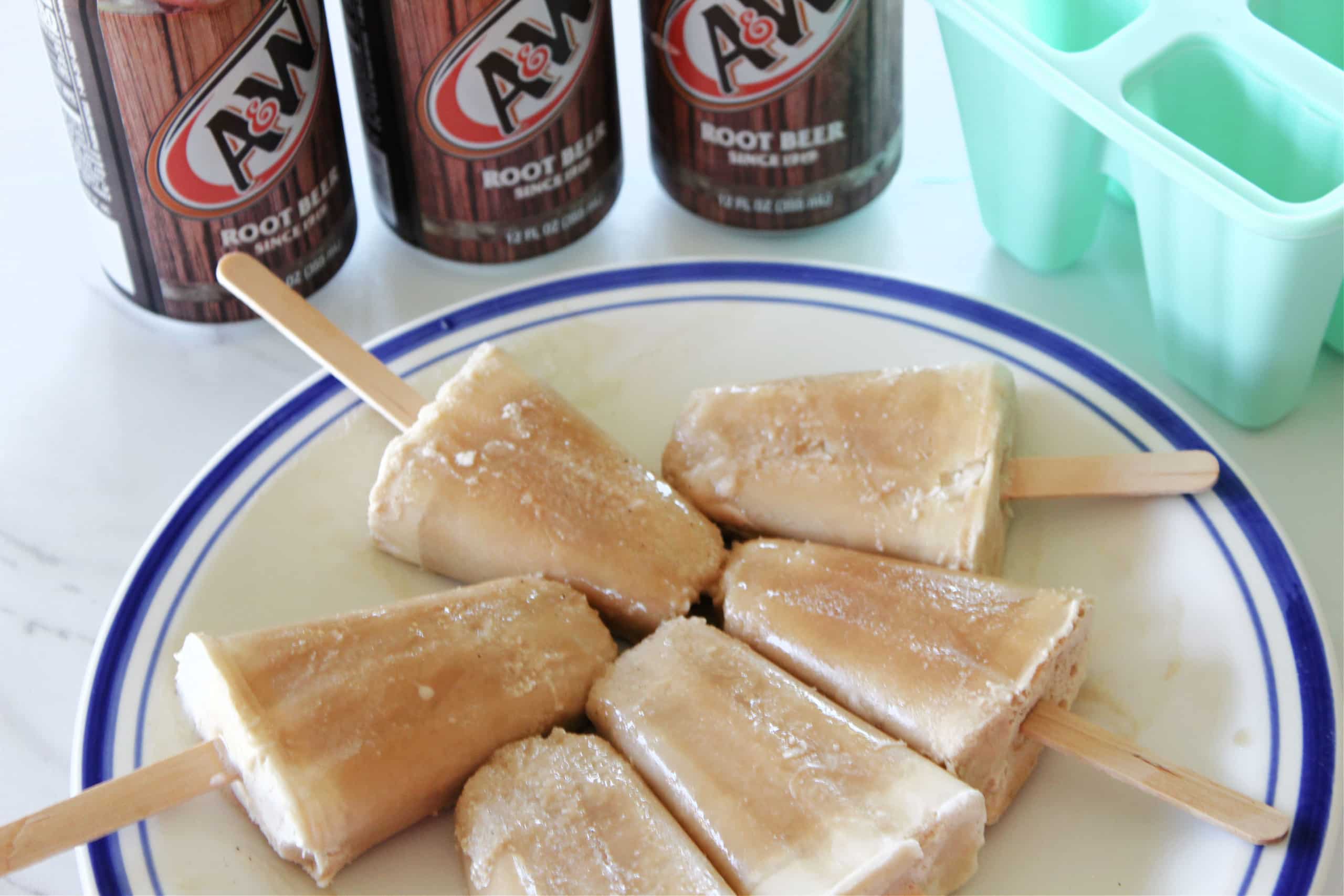 Frozen Popsicles displayed on a plate.