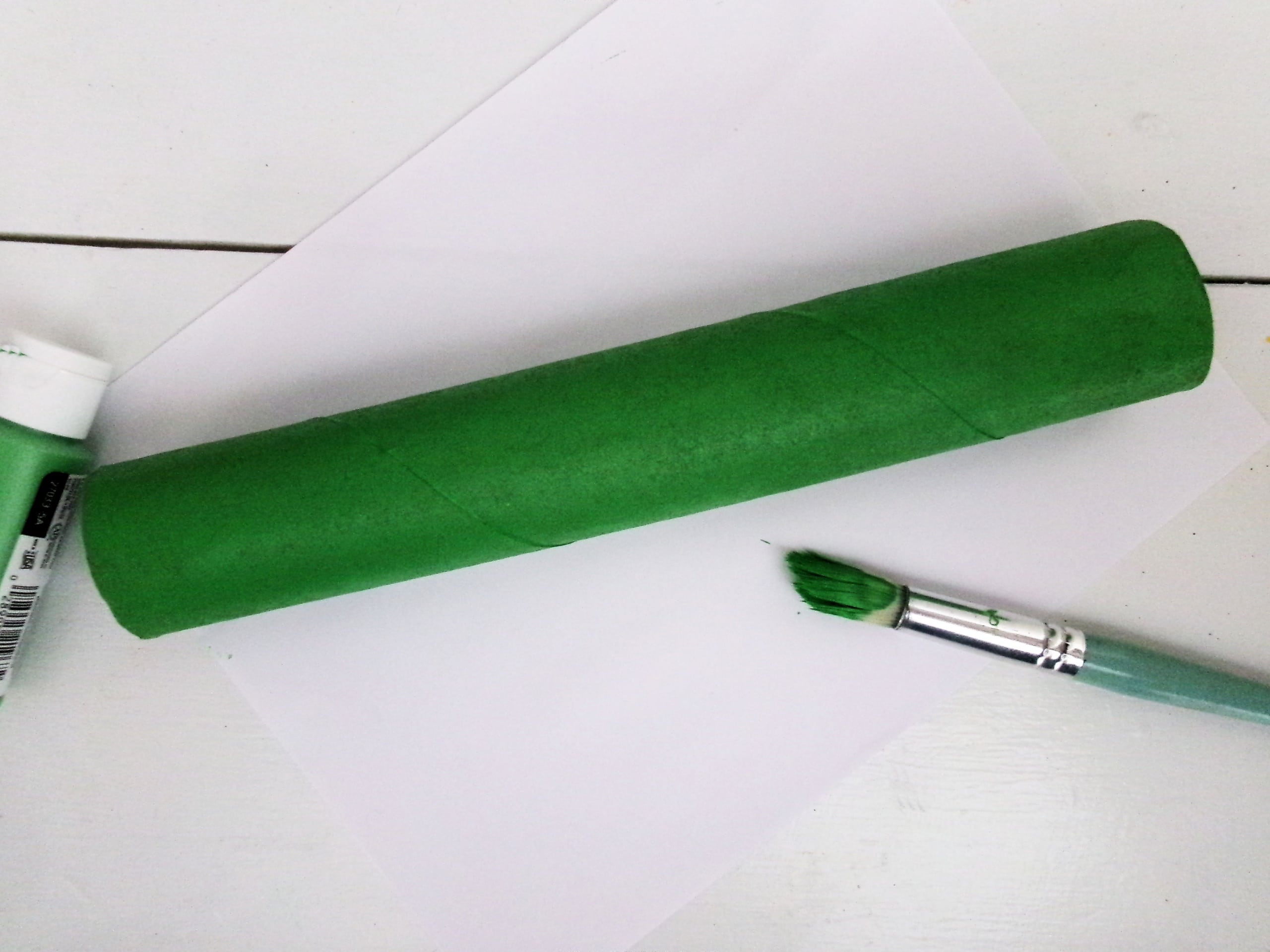 Start by painting a paper towel roll green.