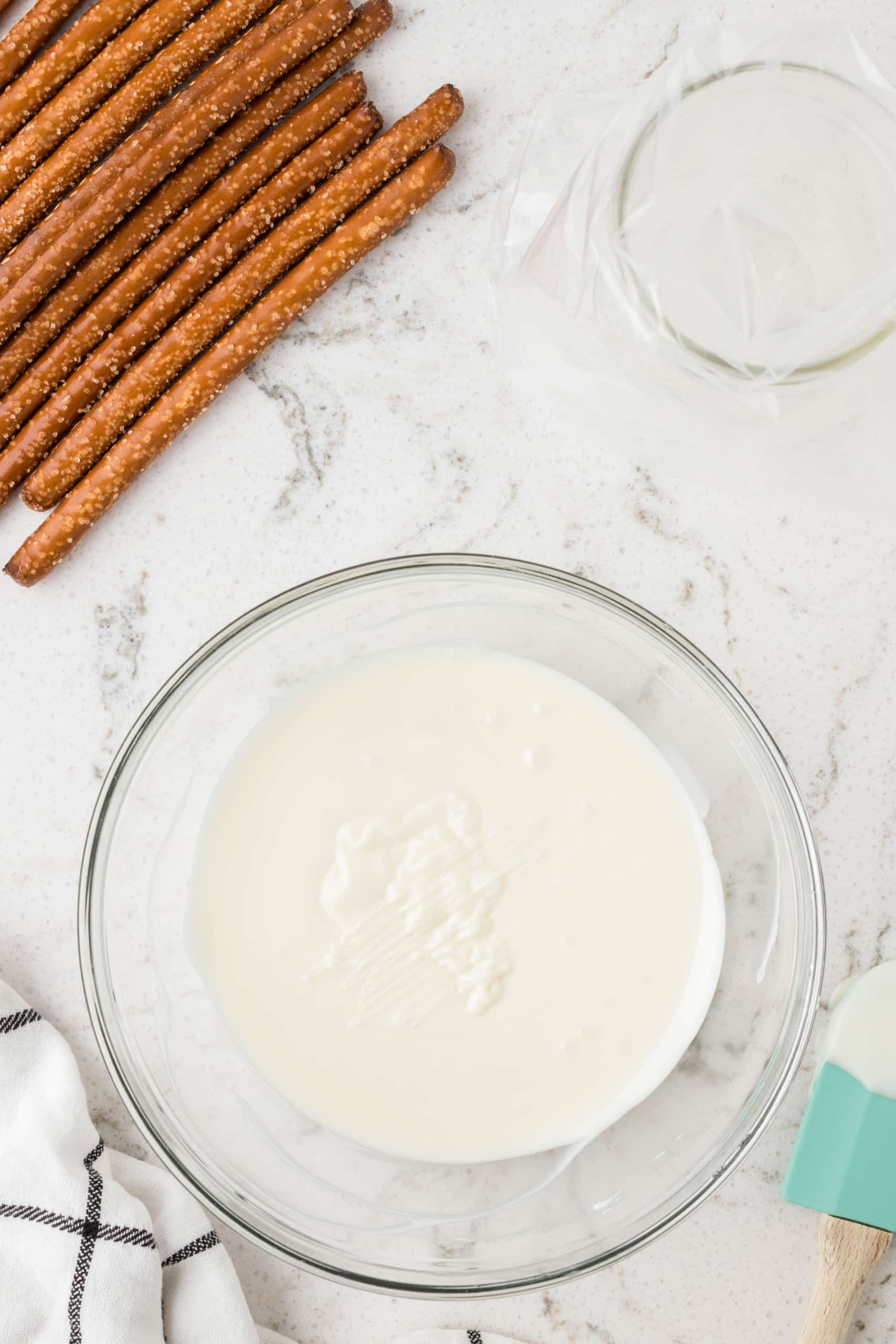 Melt the almond bark in a microwave safe bowl and put into a pipping bag.