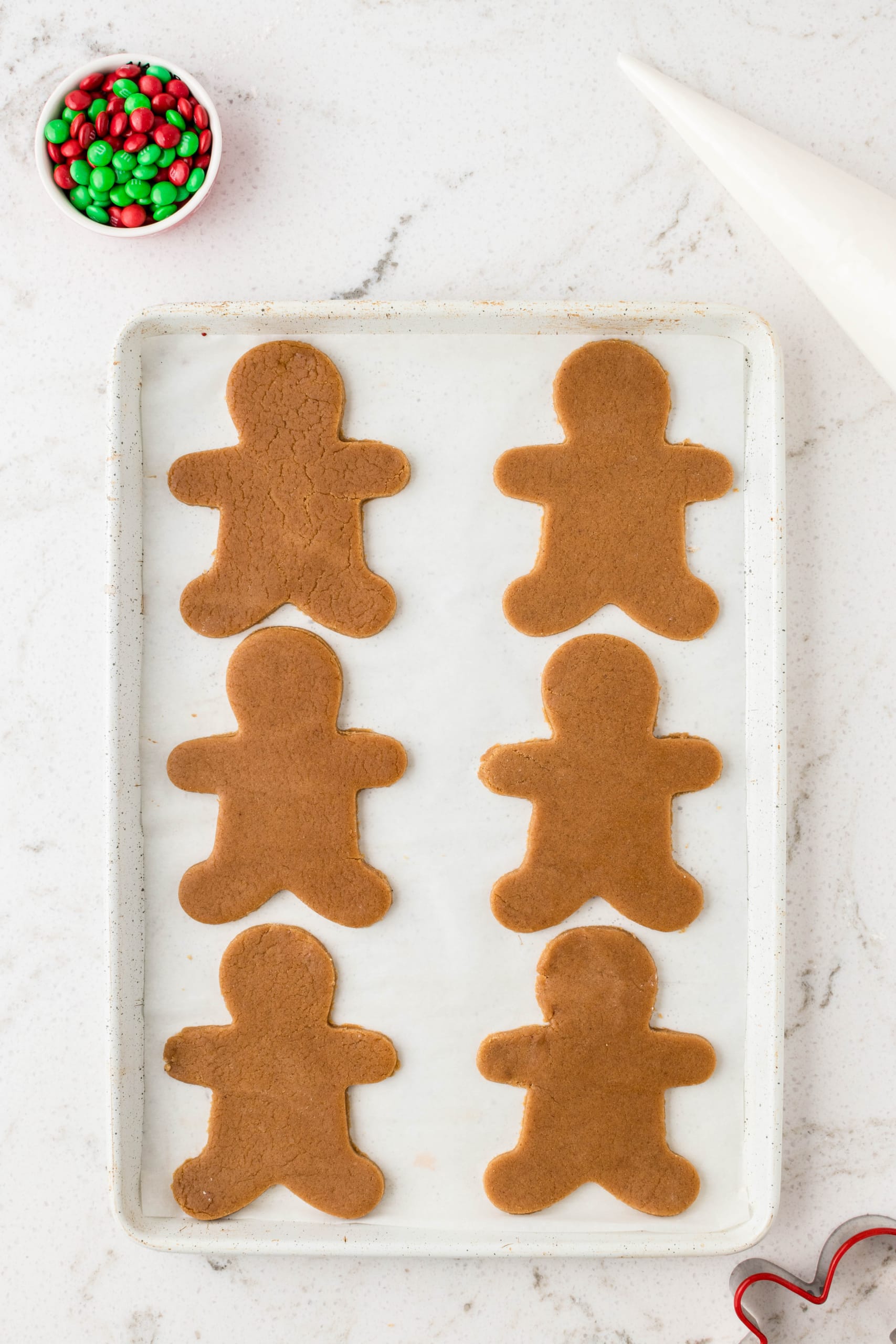 Place the Cut out gingerbread man on a prepared cookie sheet