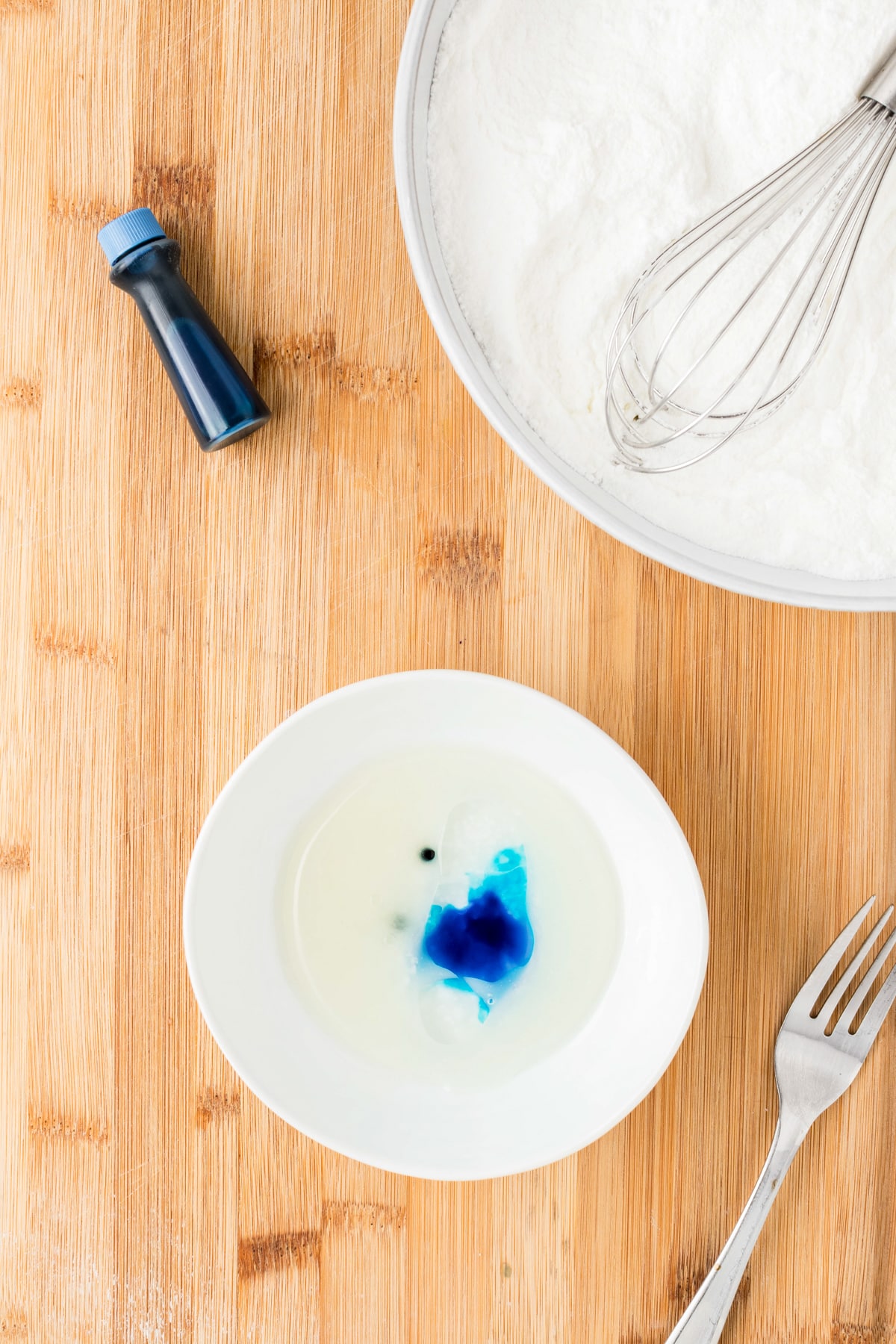 Mix the coconut oil and water together. add a few drops of food coloring if you'd like.