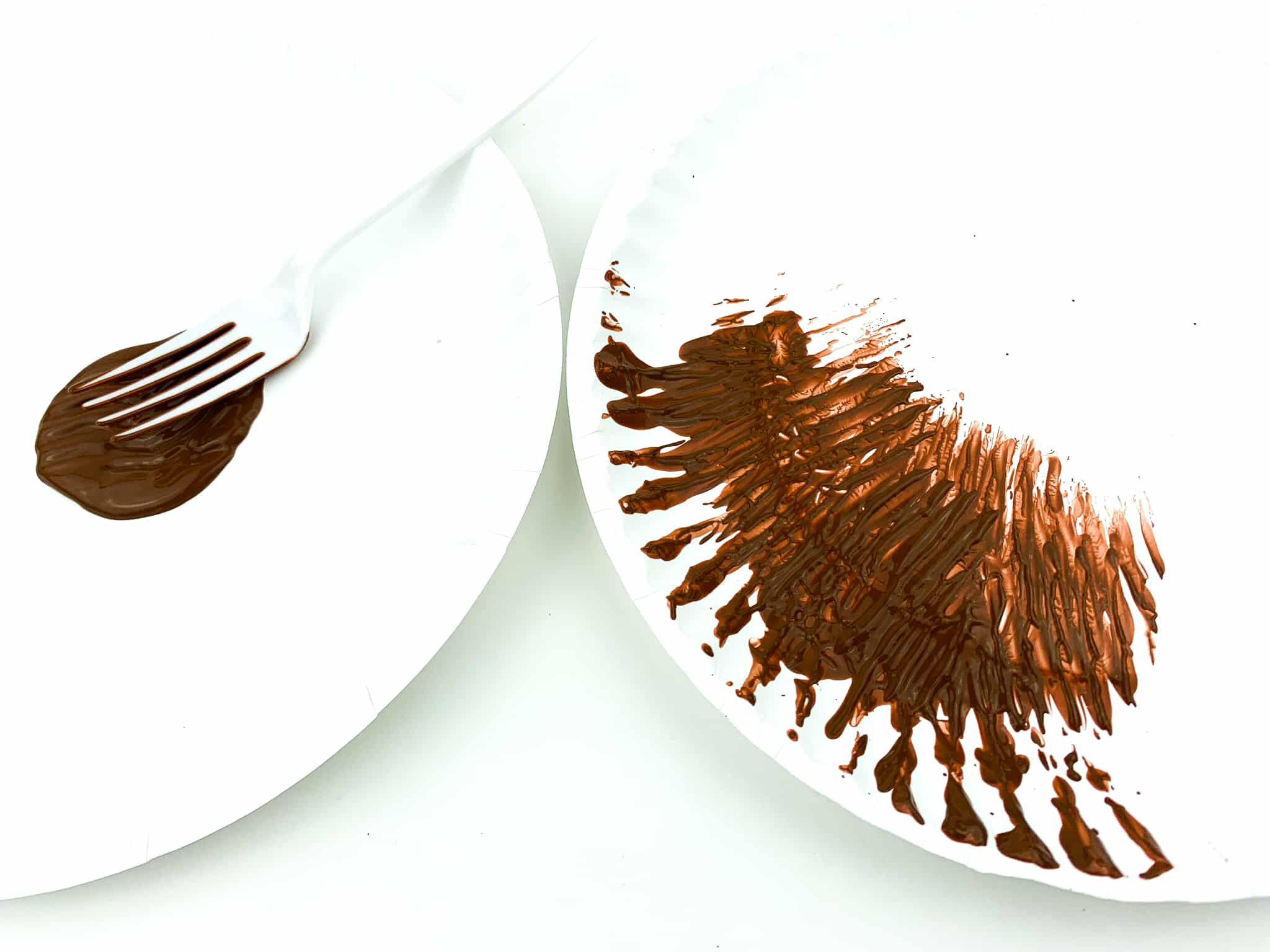 Press a plastic fork into the brown paint and make fork lines all over another paper plate.