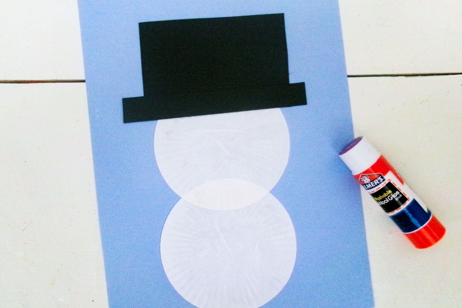 Snowman made with cucpake liners and a black hard