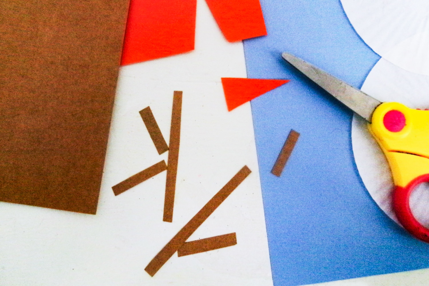 Brown paper cut for snowman arms