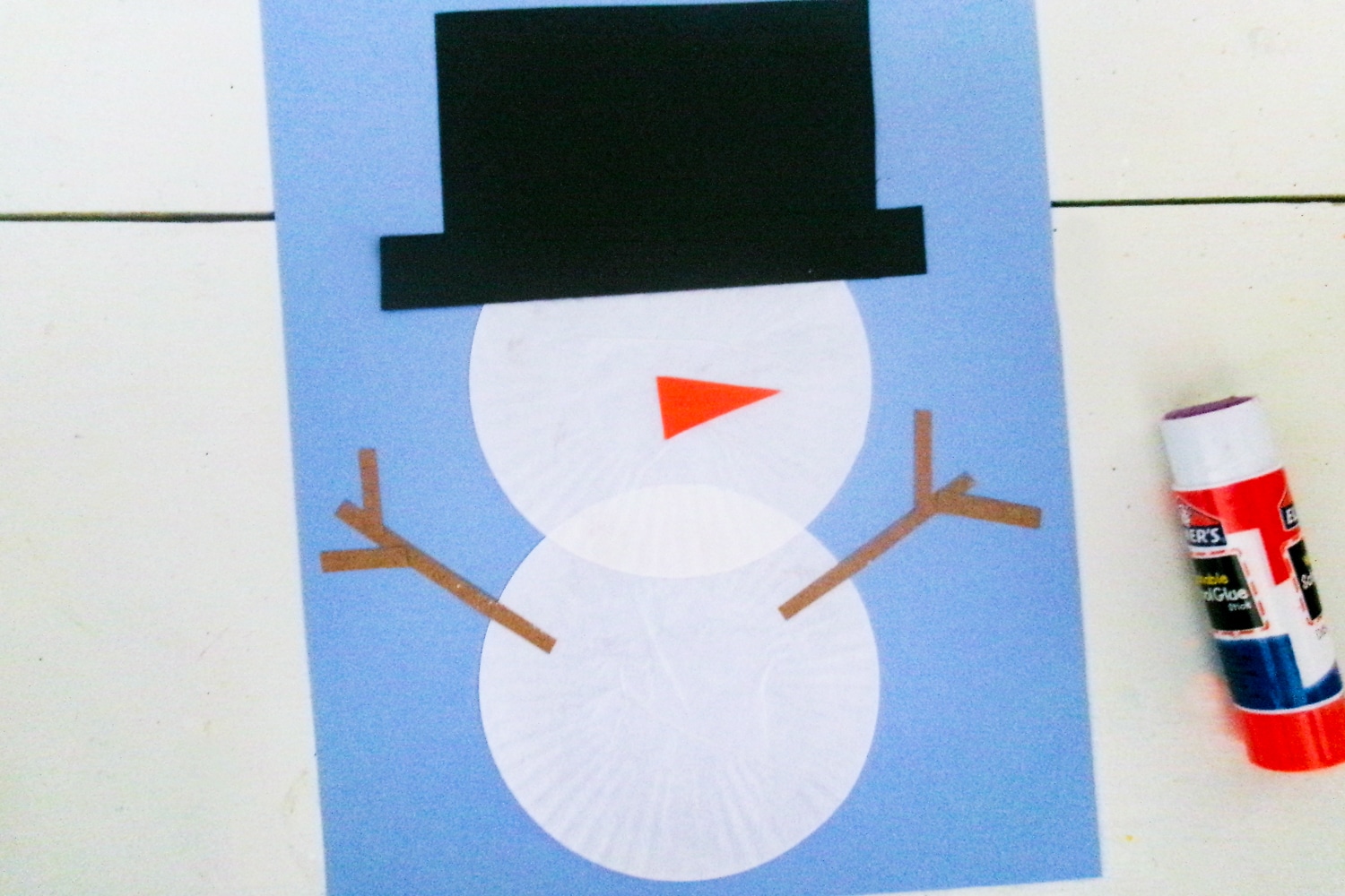 Snowman with arms and nose