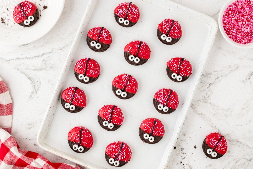 Allowing Lady Bug Oreos to harden on a parchment lined cookie sheet