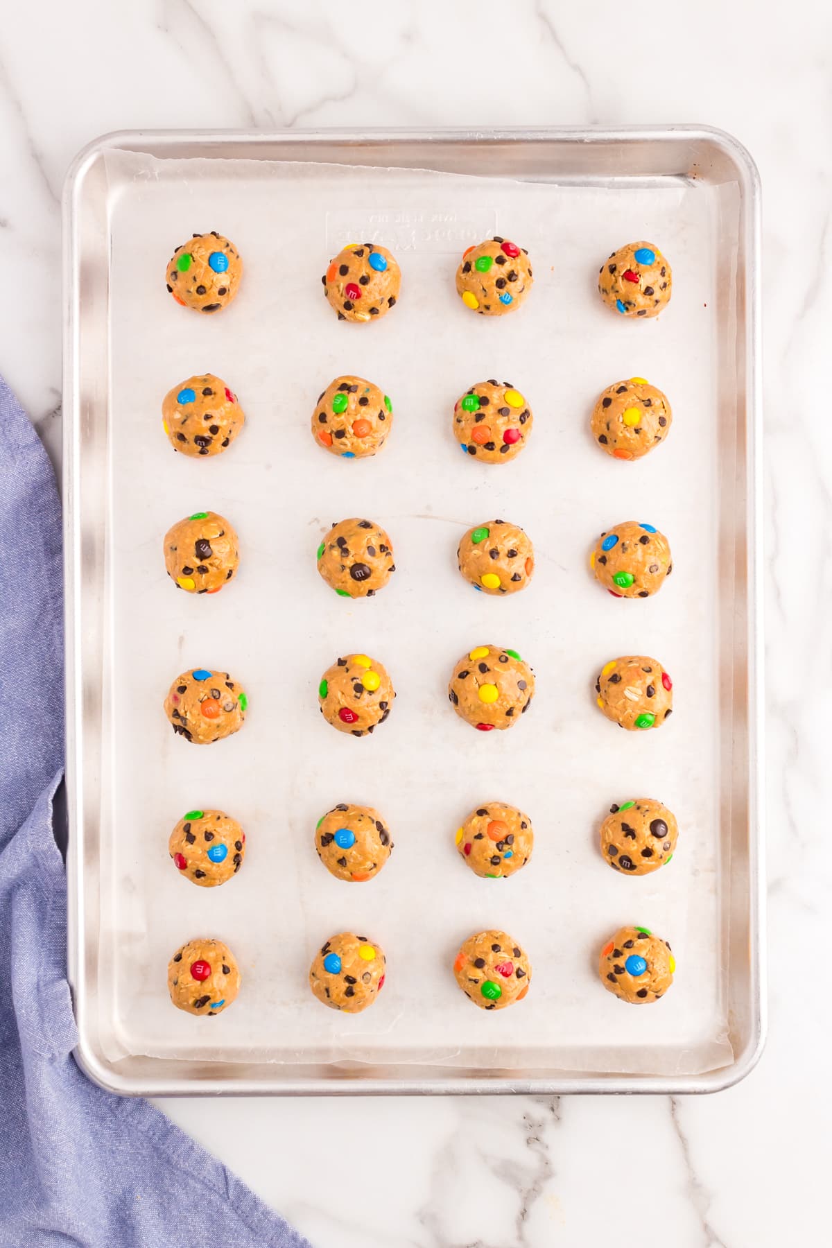 Using a cookie scoop, roll 1 inch balls together and put on a cookie sheet to put in the fridge to cool.