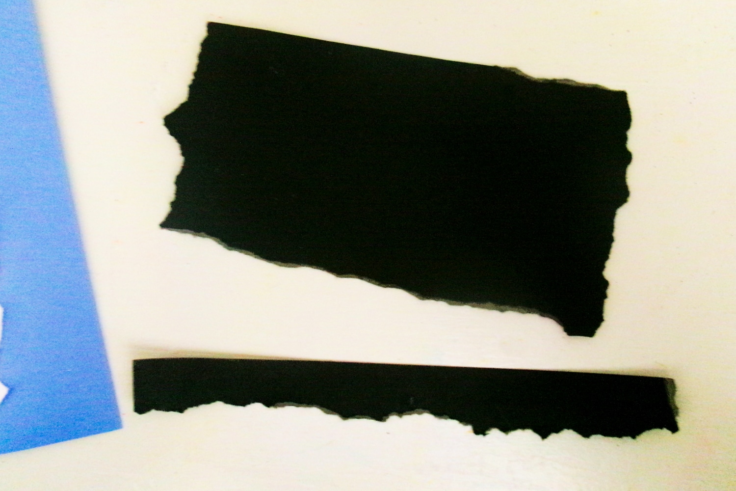 Ripped black construction paper