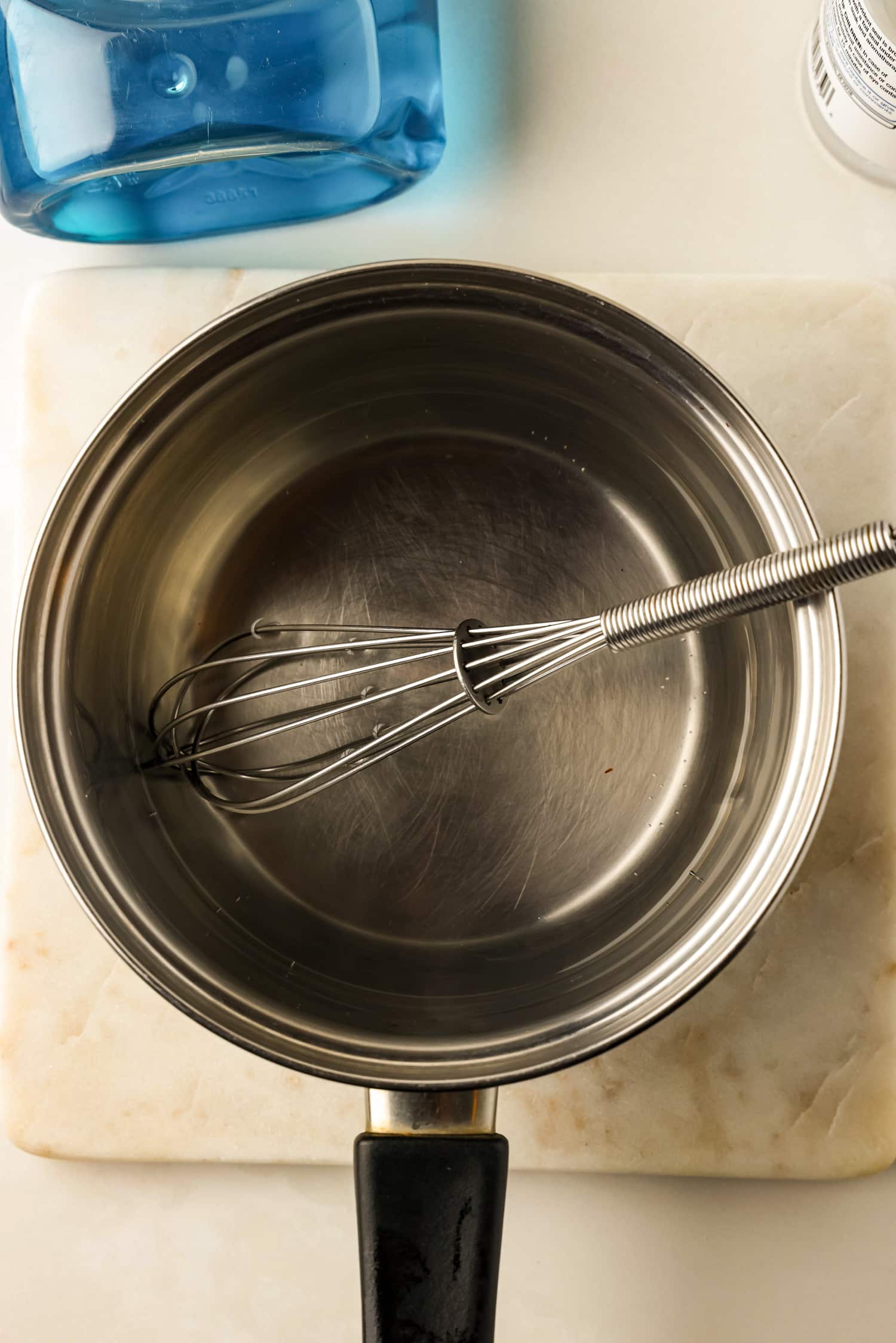 Pour water into a sauce pan and heat until water is lightly steaming. Remove from heat.