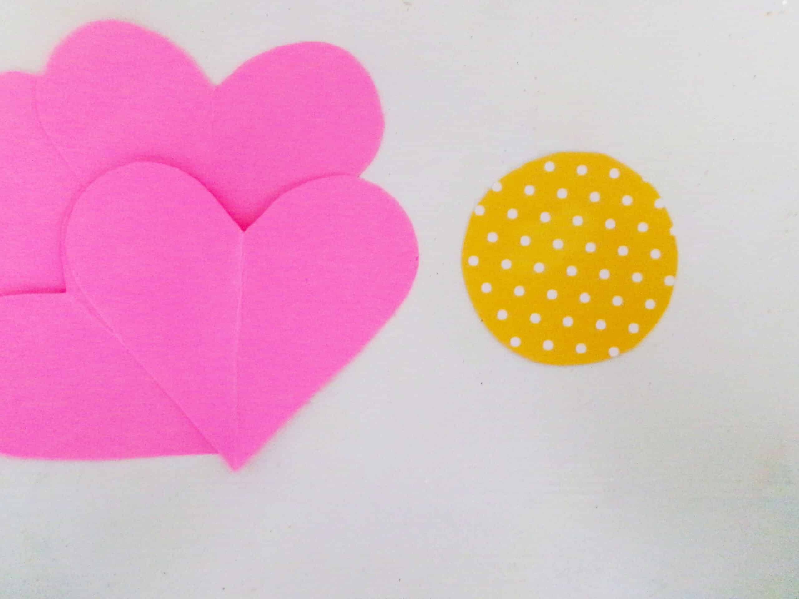 Cut a circle out of the polk a dot paper.