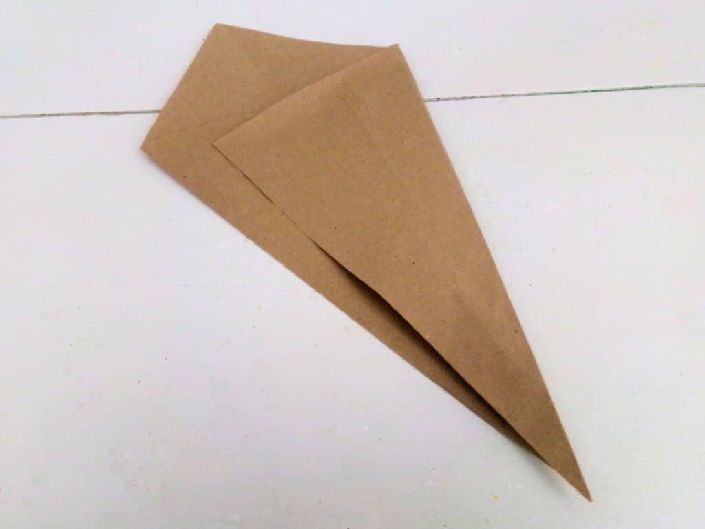 Position like a diamond and fold in the sides to make a pocket for the flowers to sit.