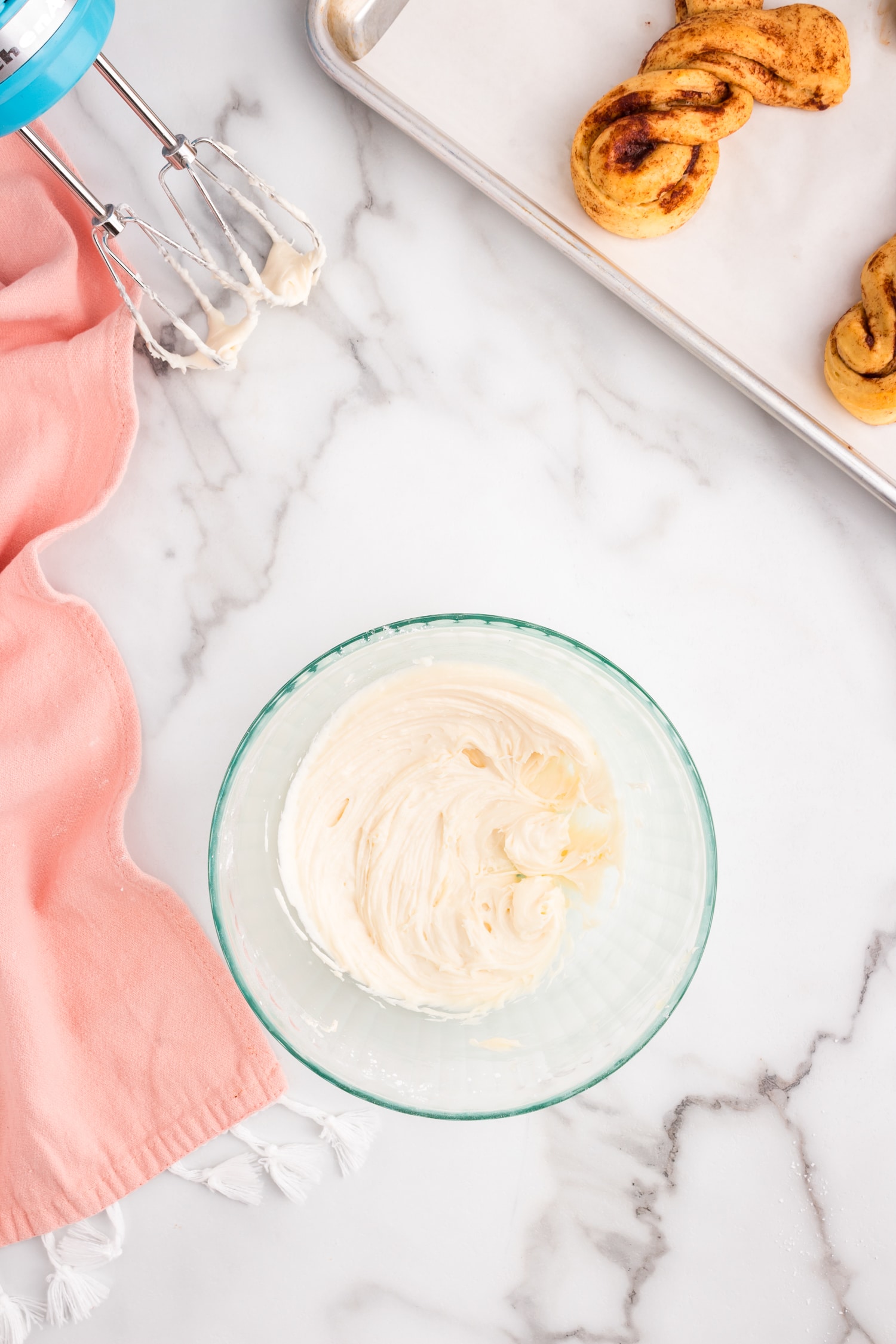 While they are cooling, in a medium mixing bowl add the cream cheese, butter, powdered sugar and vanilla.