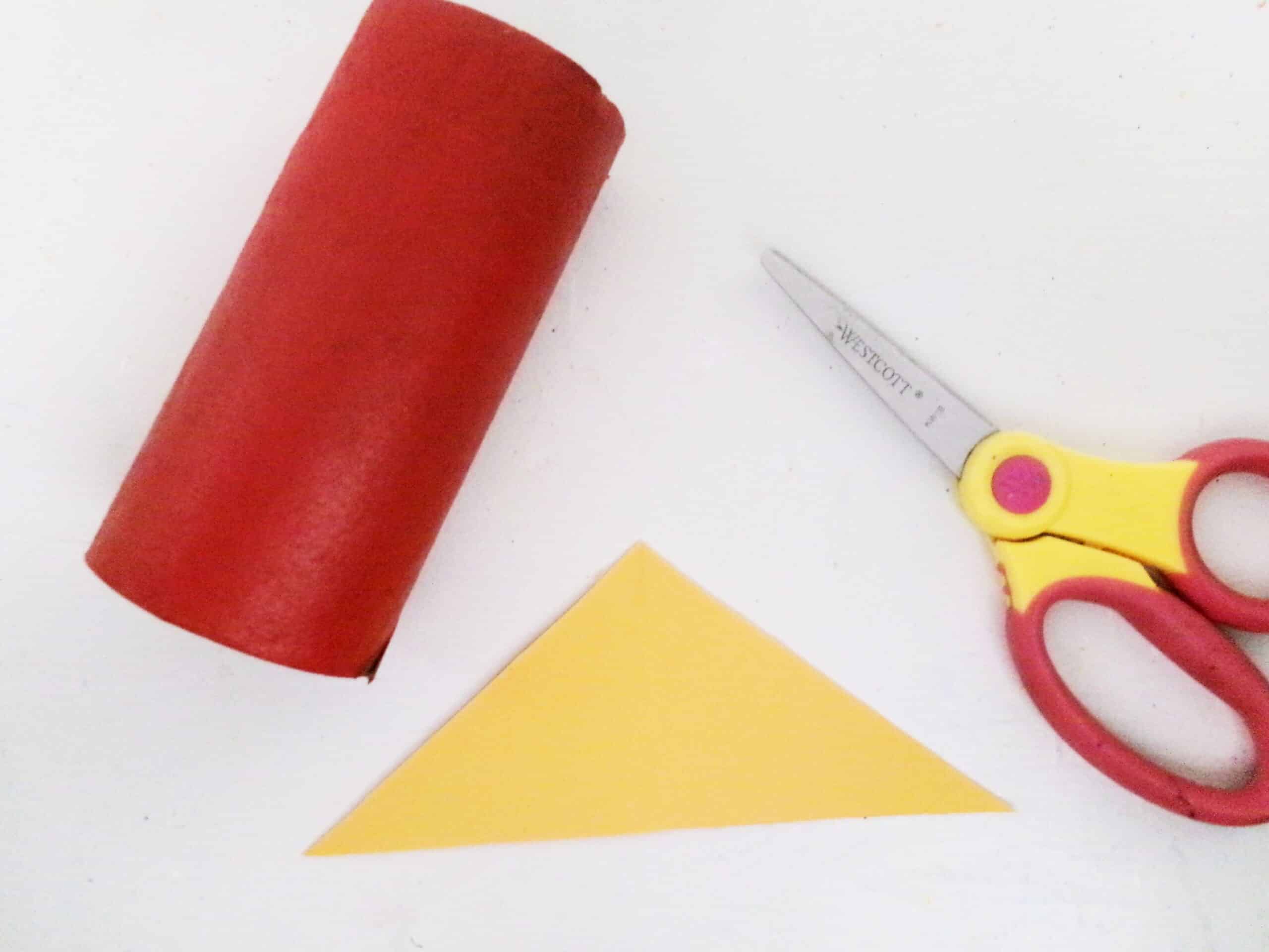 While the paint is drying cut out a triangle in yellow cardstock.