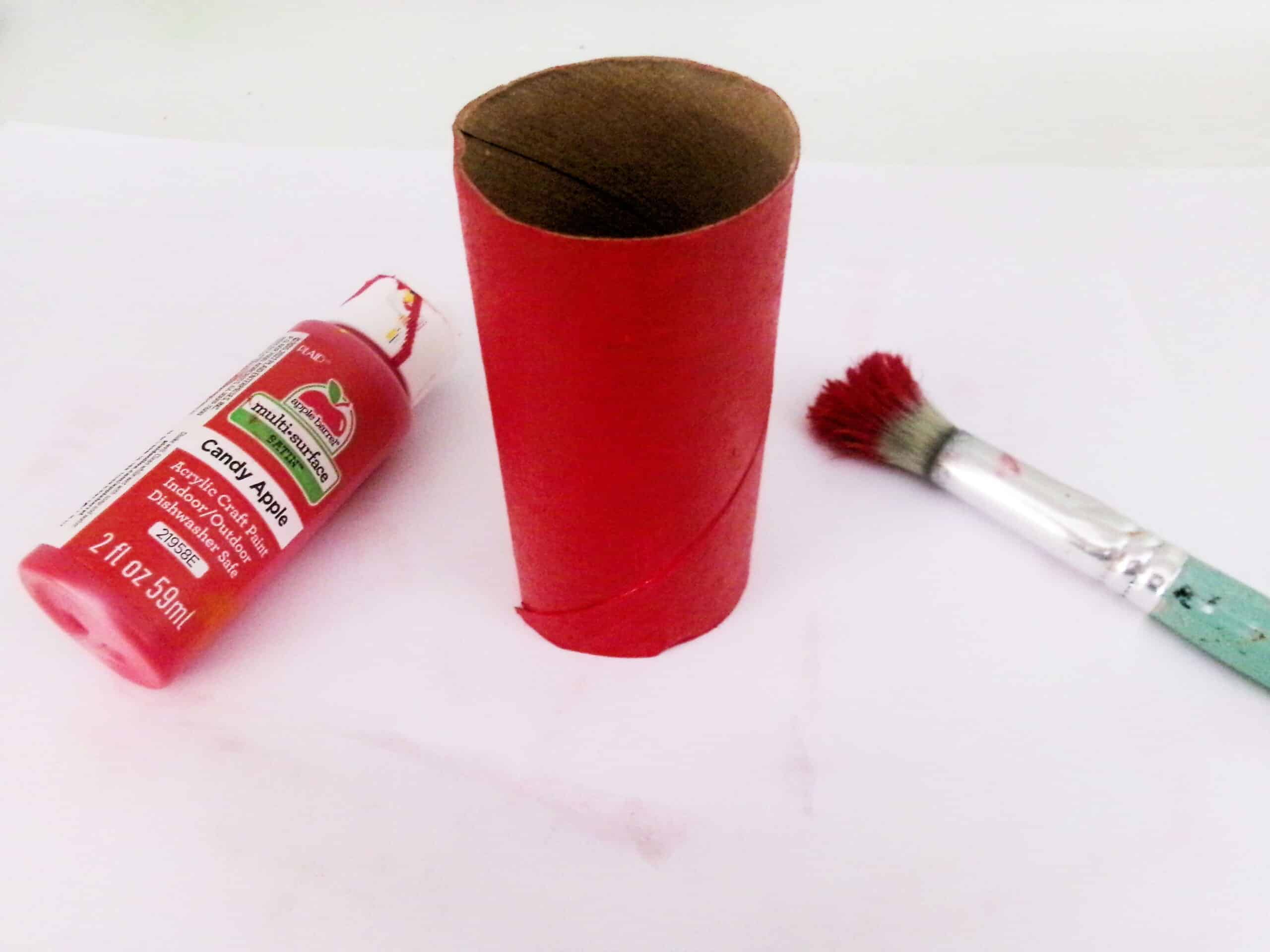 Start by painting the toilet paper roll any color you'd like.