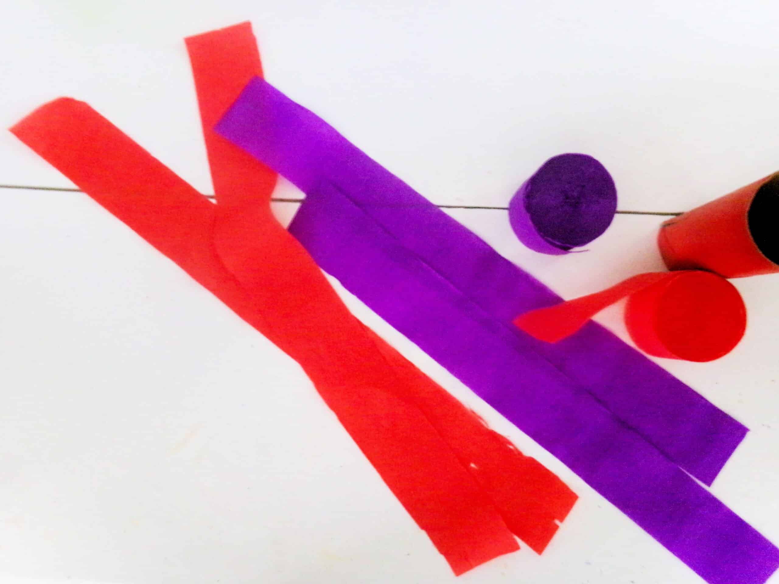 Cut 4 streamers. Two red and two purple.