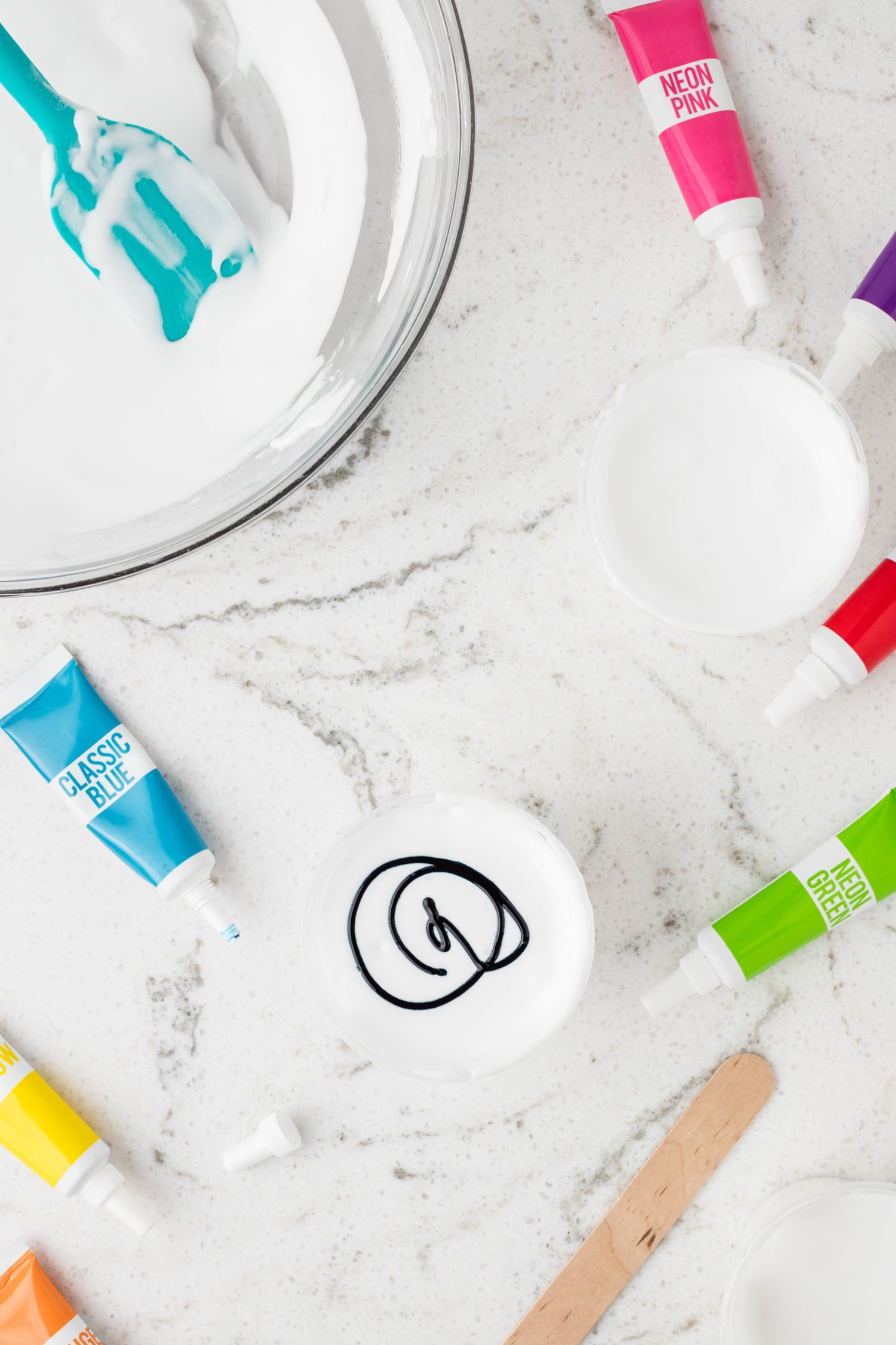 Add mixture into small containers for multiple colors. Add a few drops of food coloring to each container.