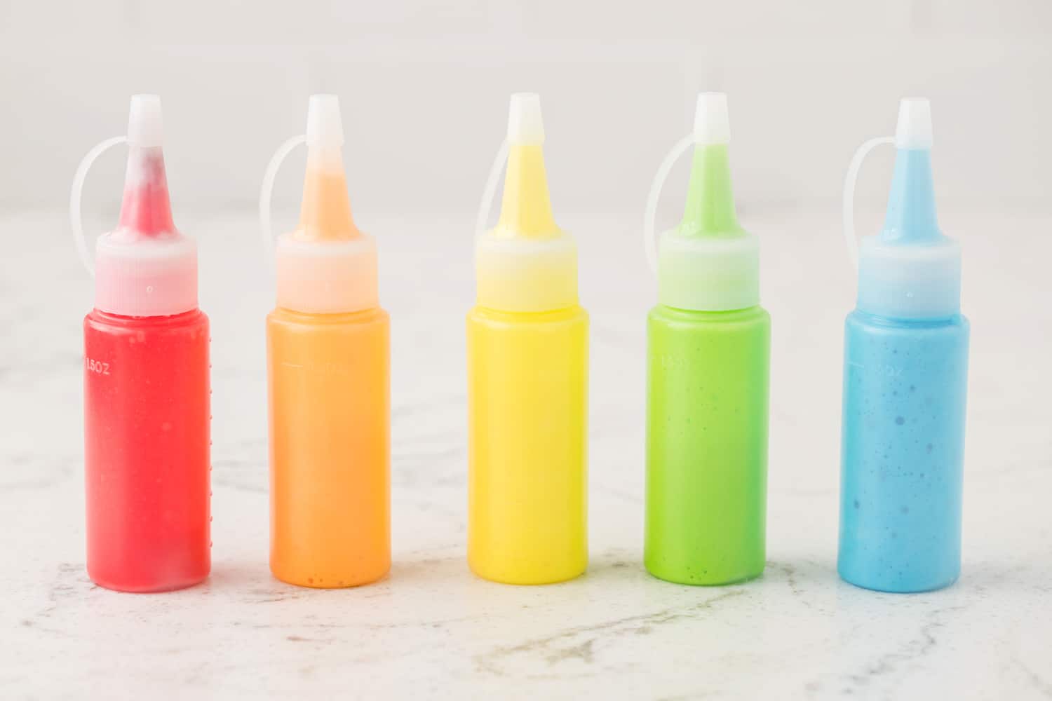 Transfer colored mixture into small squeeze bottles.