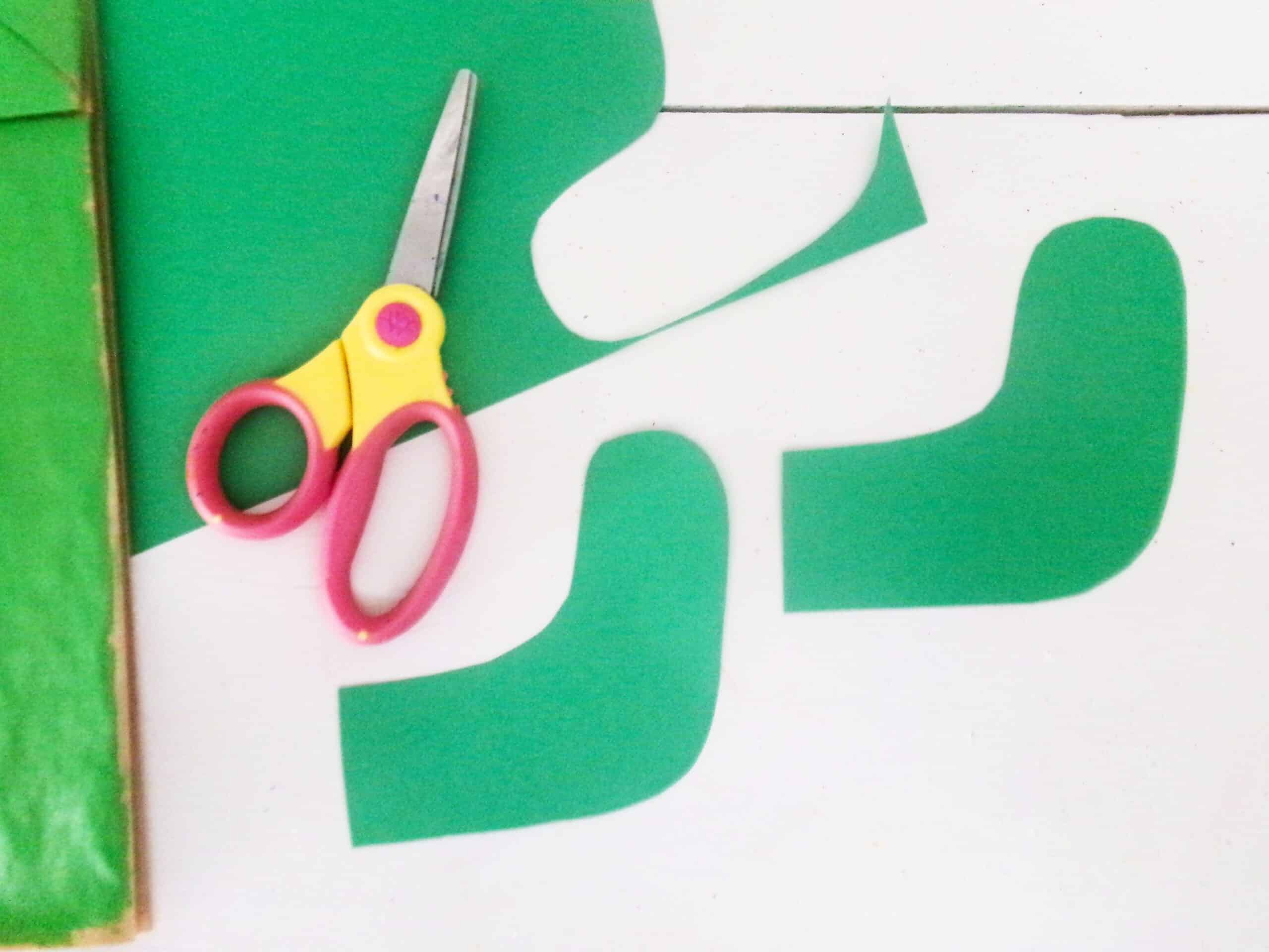 Cut out the cactus arms with green cardstock.