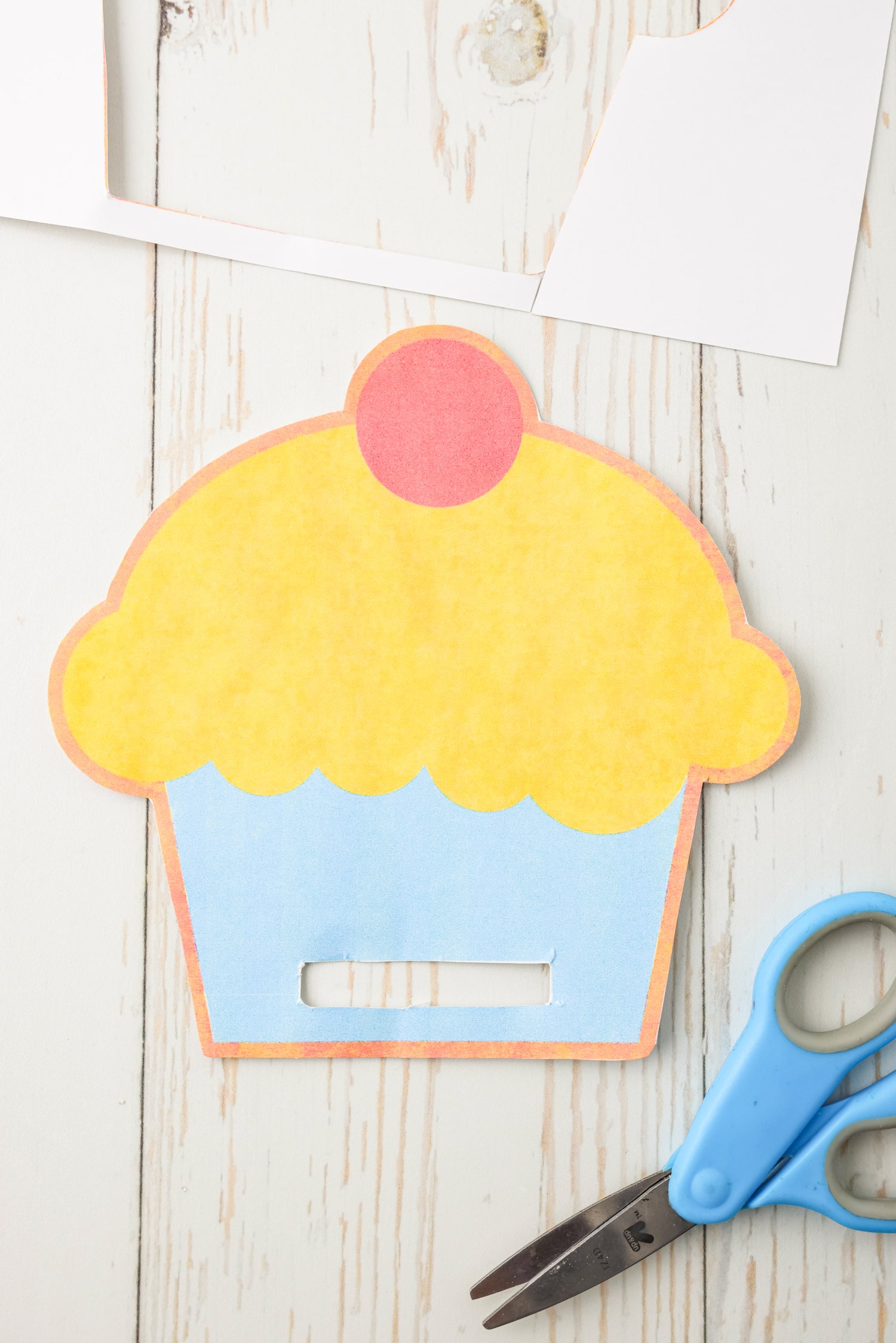 Cut out the cupcake and the middle strip at the bottom.