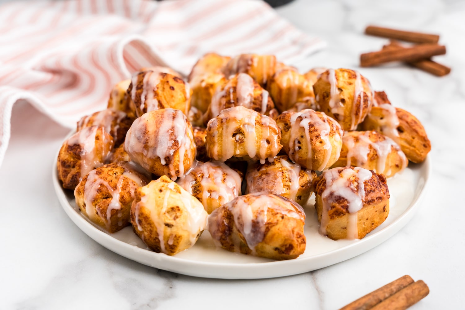 a Large White plate filled with Cinnamon Bites.