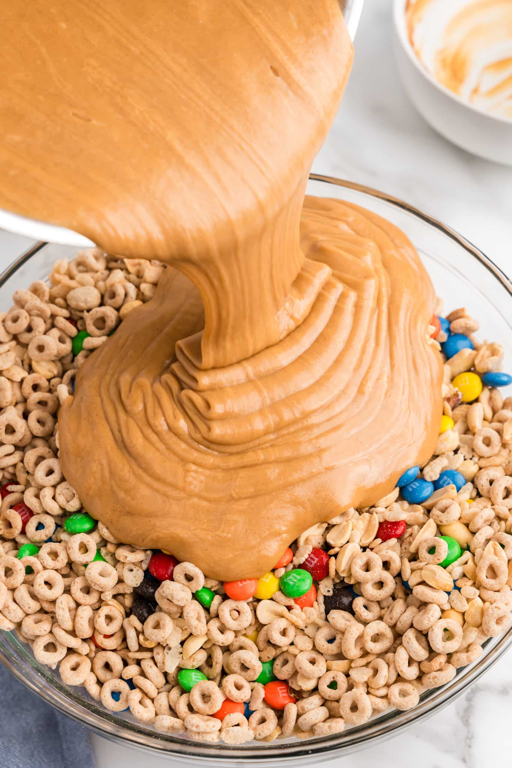 Pour syrup mixture over the cereal mix and toss until fully coated.