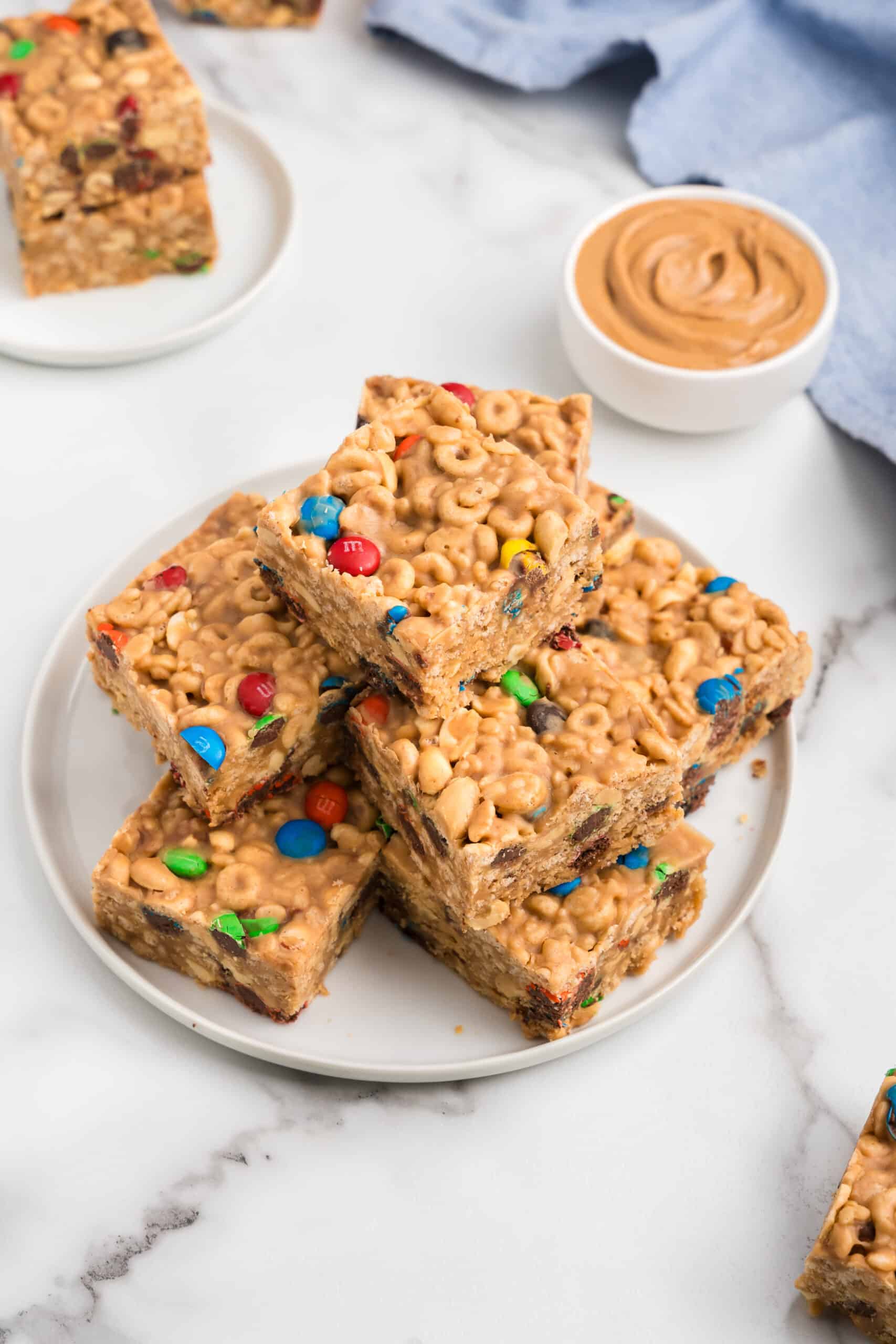 a White plate filled with cereal bars one on top of the other.