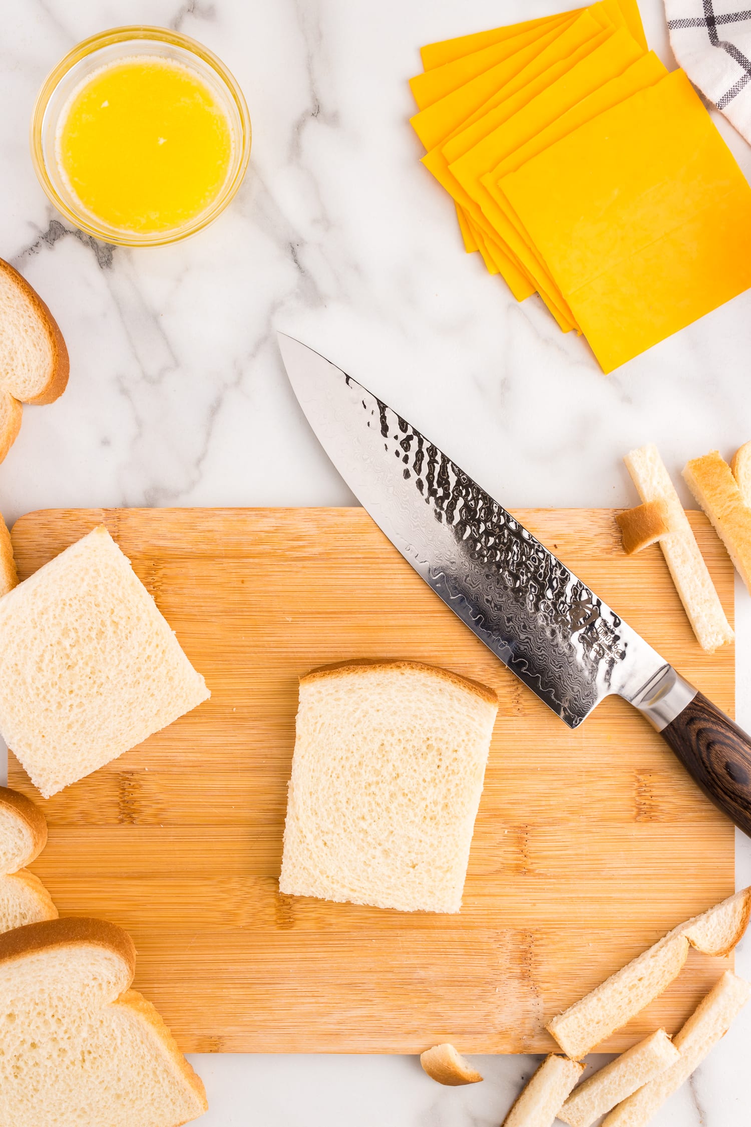 Cut the crust off of each slice of bread.