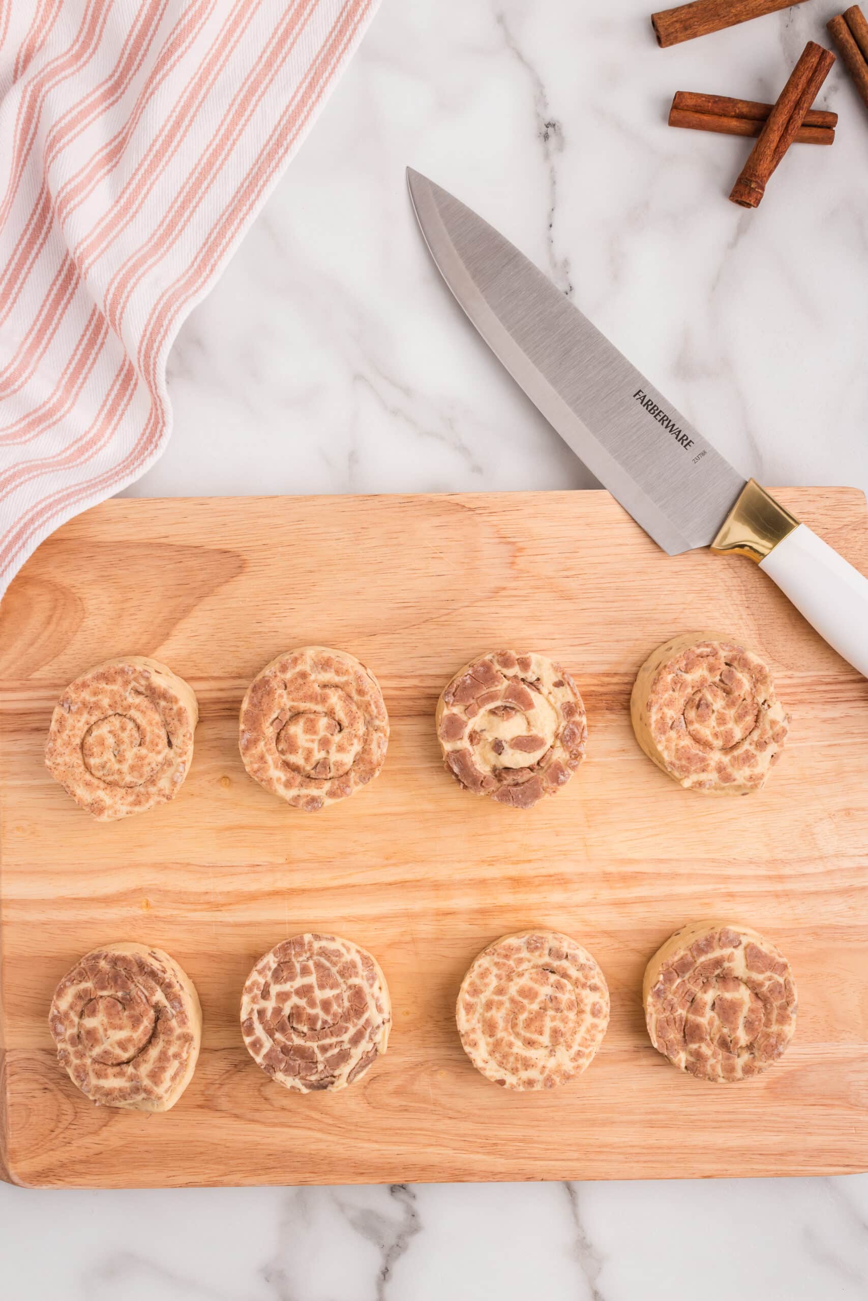 Take the Cinnamon rolls out of the can and place them on a cutting board.