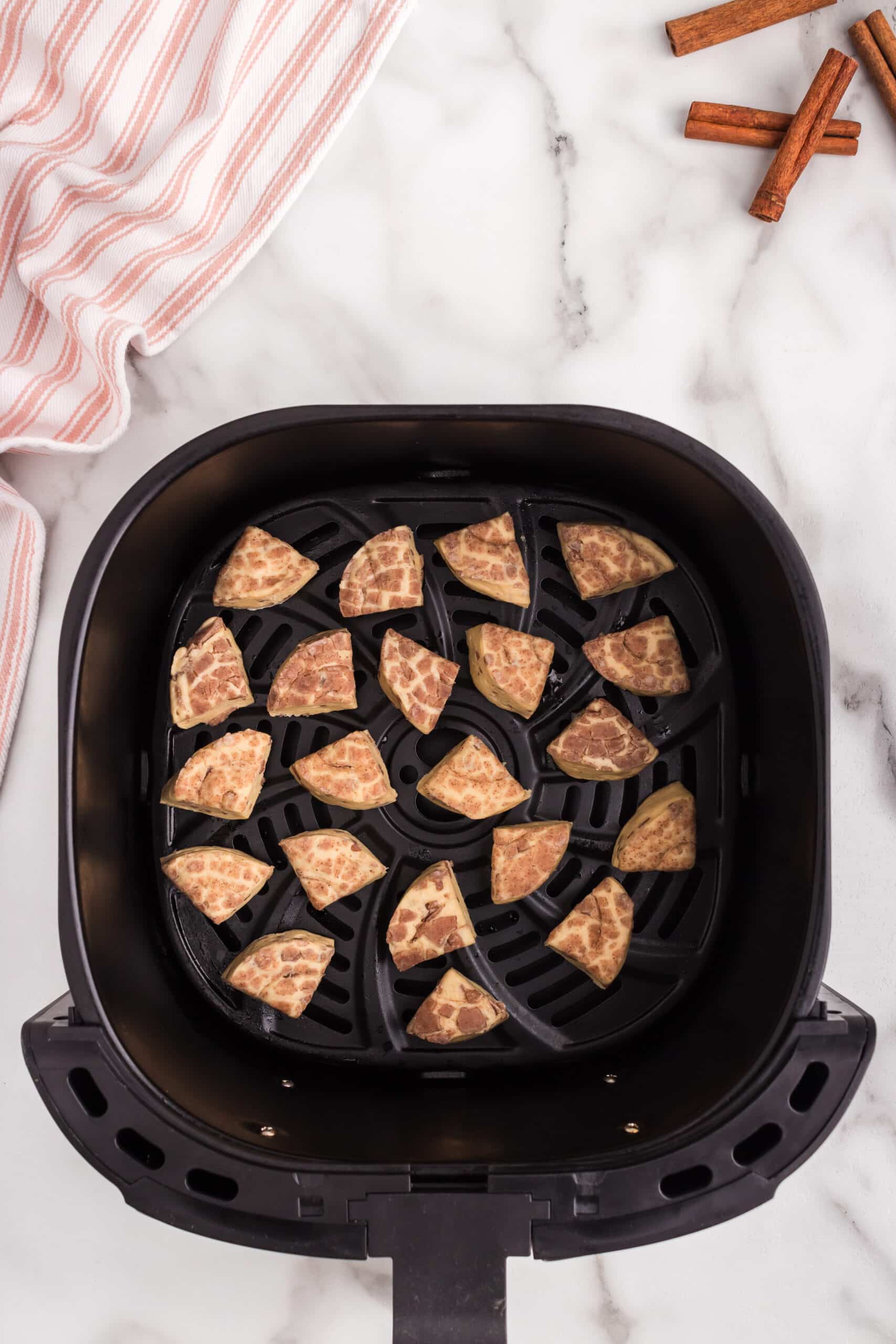 Place the pieces into the air fryer basket.
