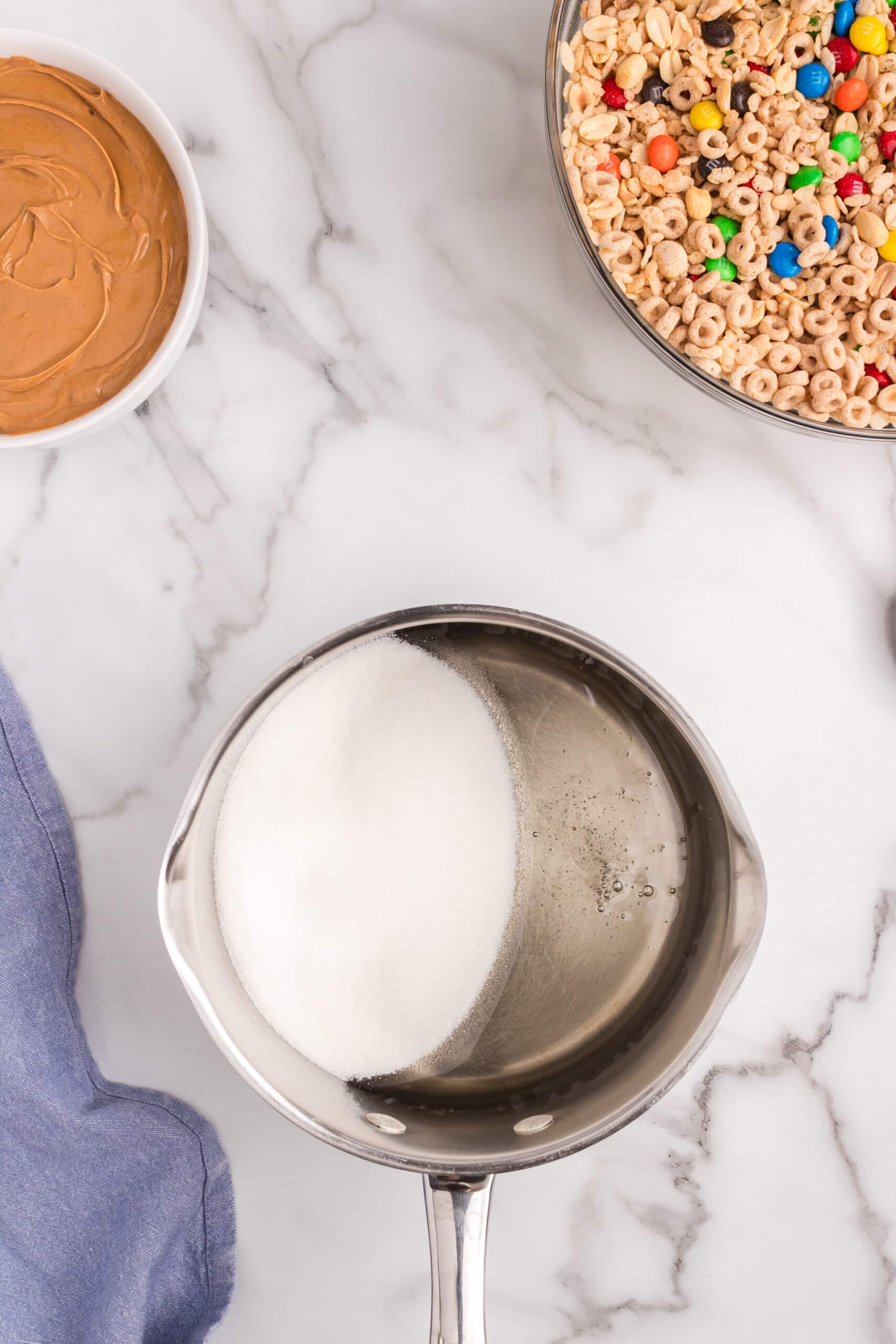 In a medium sauce pan bring the sugar and corn syrup to a boil.