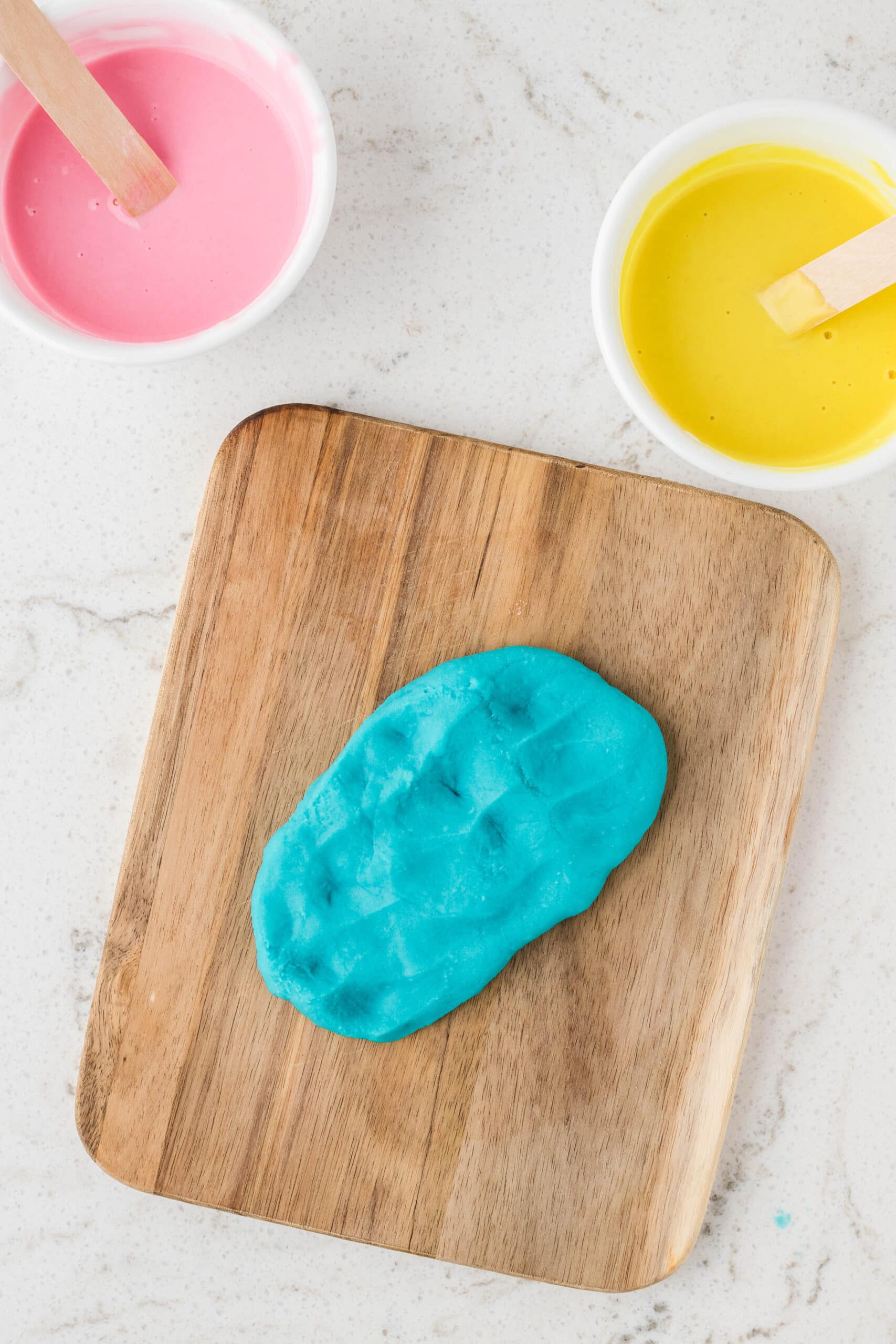 Once the playdough has cooled you can knead it on a clean surface until its smooth.