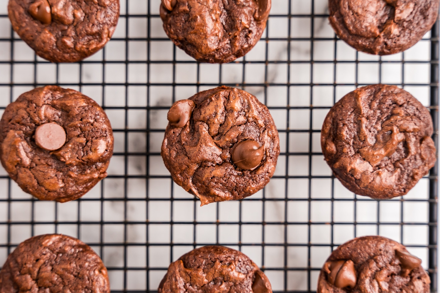 Brownie bites cooling on a cooling rack.